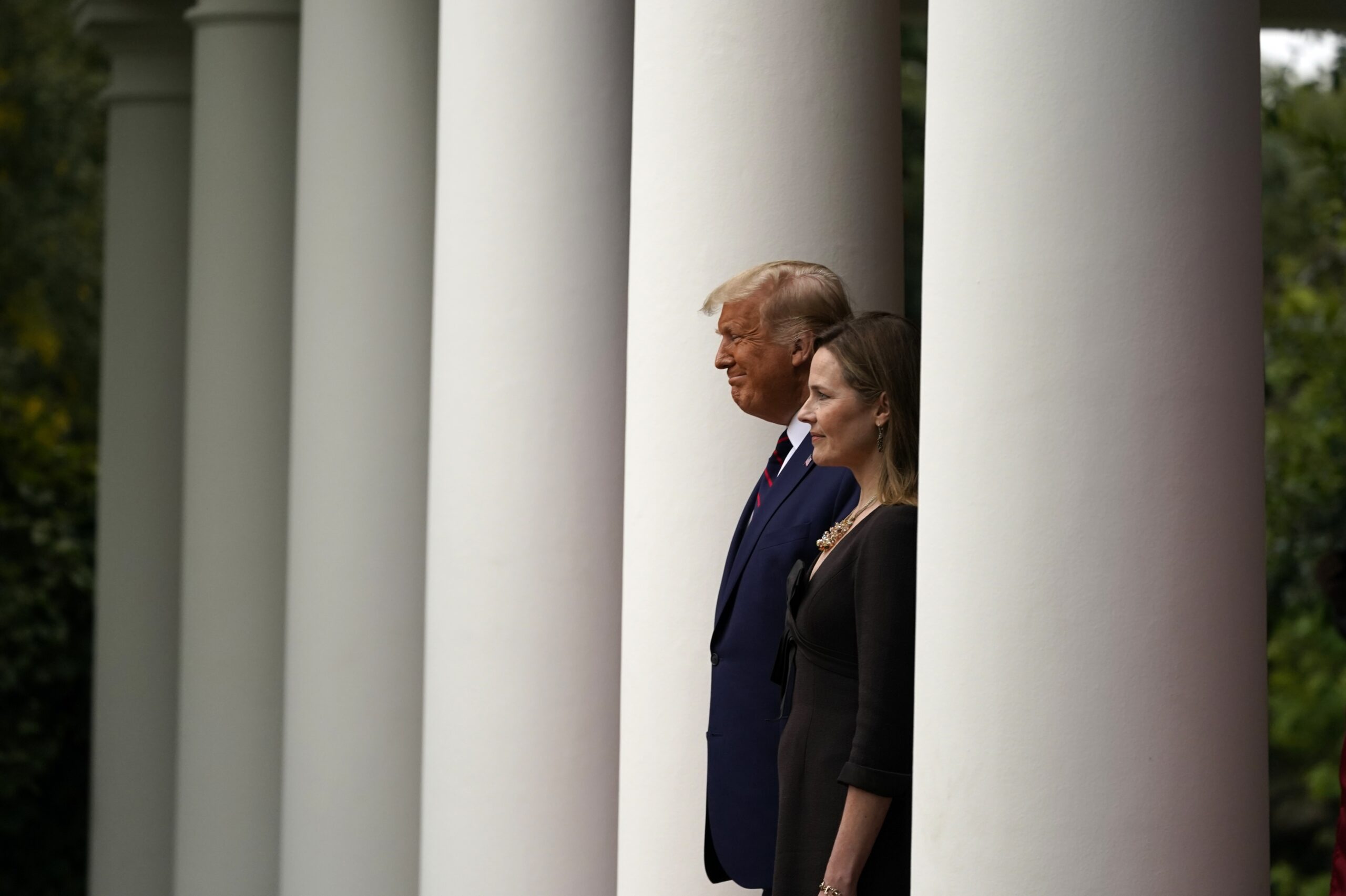 President Donald Trump walks with Judge Amy Coney Barrett