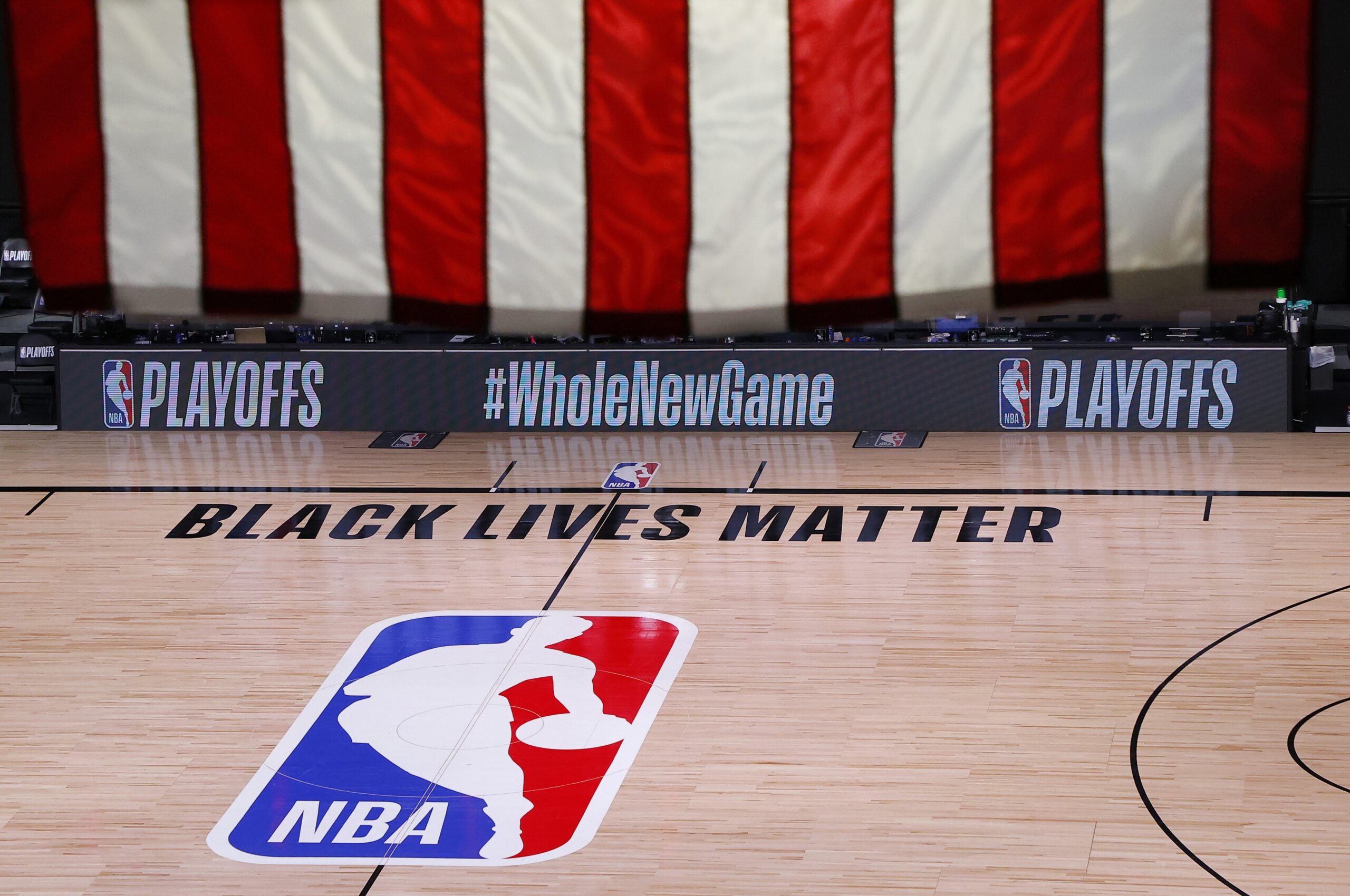 An empty court and bench are shown following the scheduled start time of Game 5 of an NBA basketball first-round playoff series