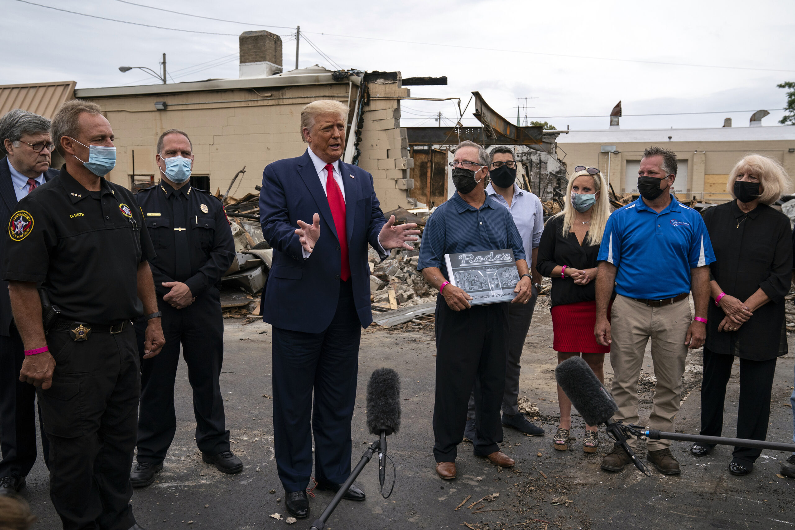 President Donald Trump speaks as he tours Kenosha damage