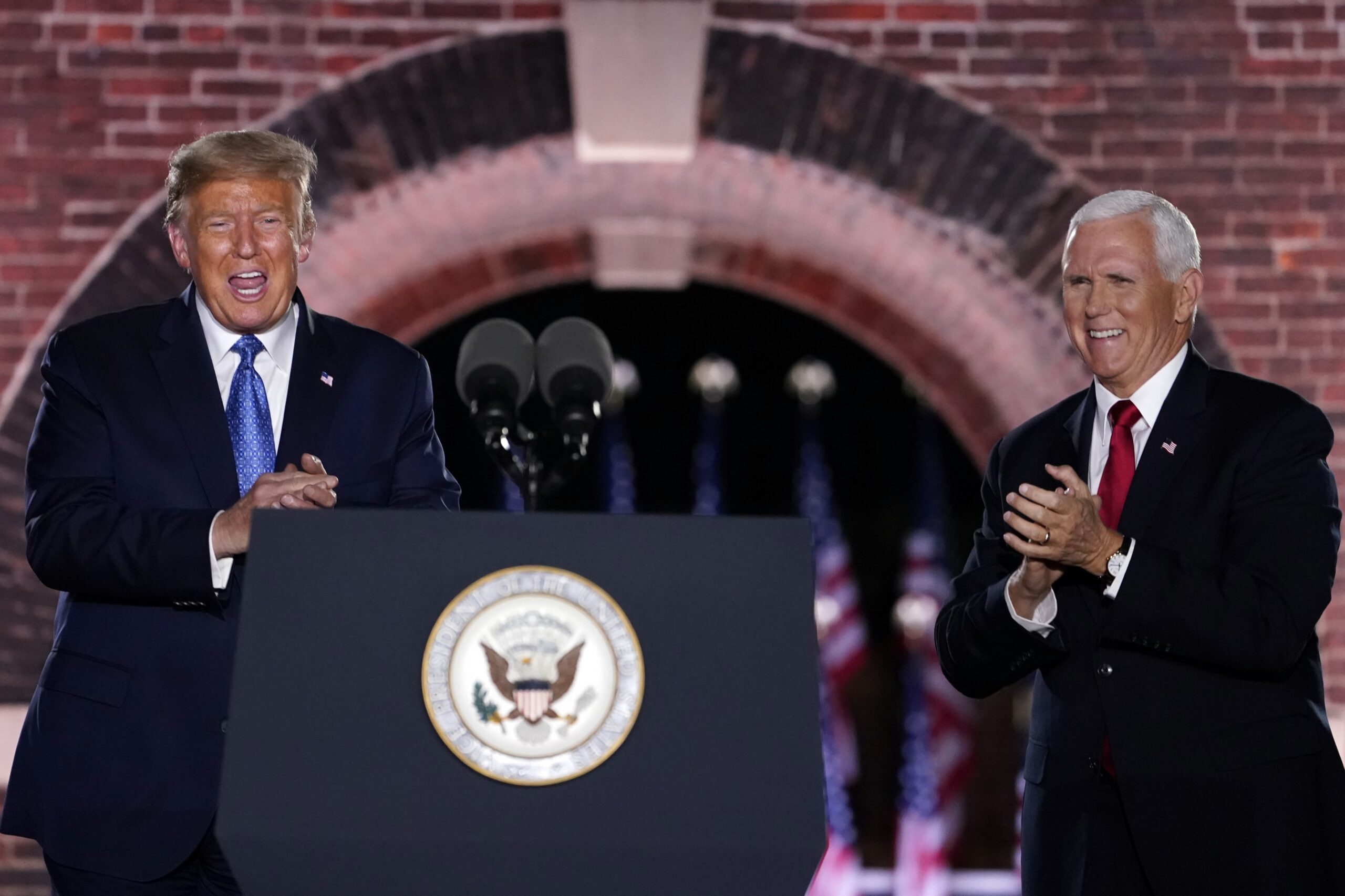President Donald Trump and Vice President Mike Pence stand on stage at the RNC