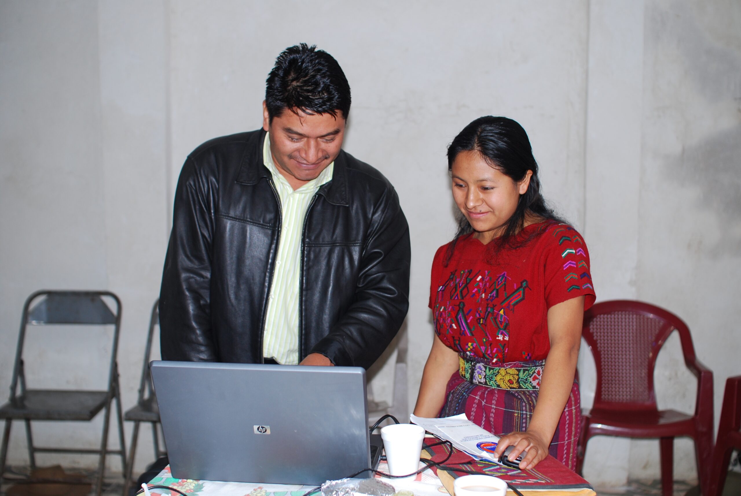 Two people working at a computer