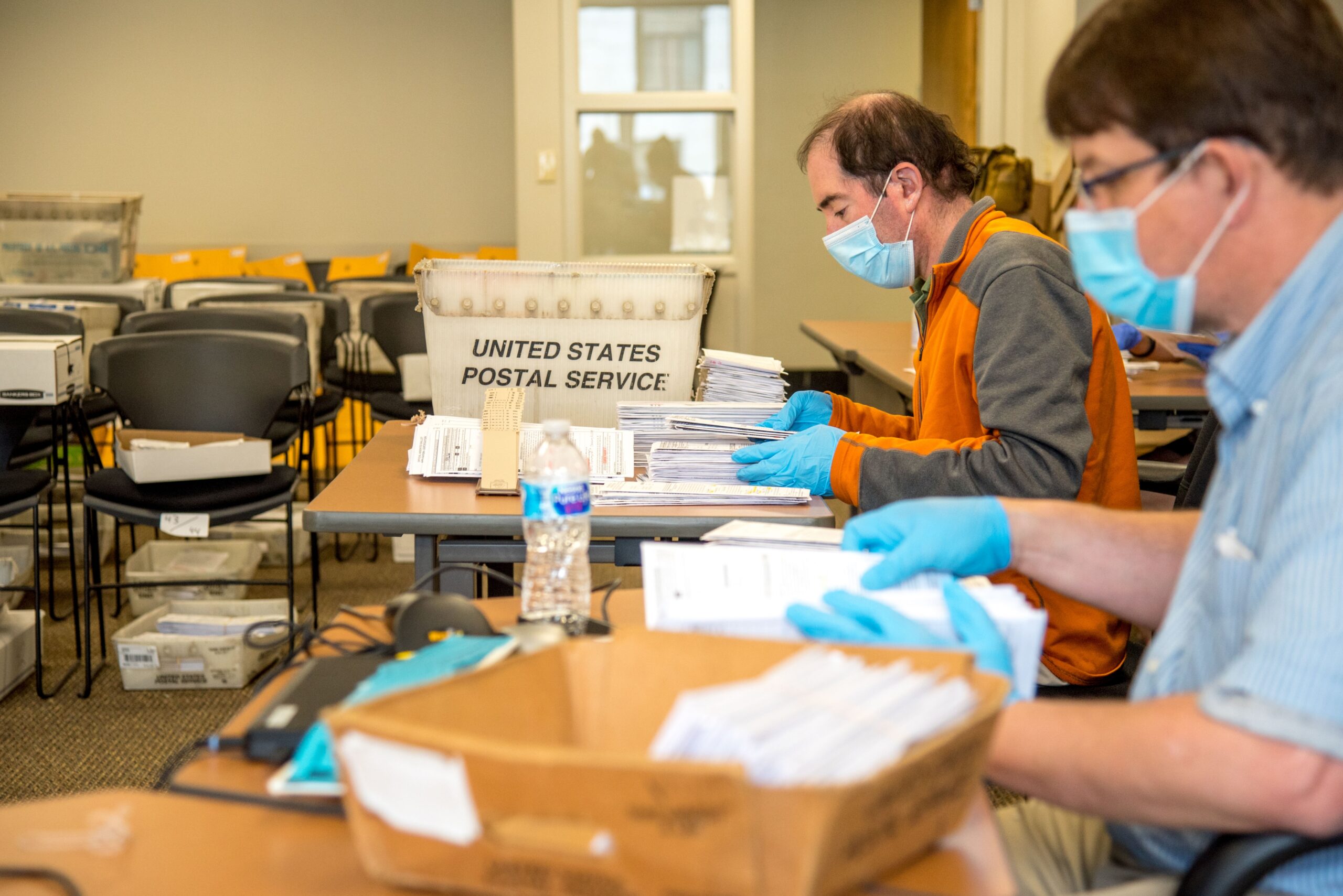 Men sorting ballots