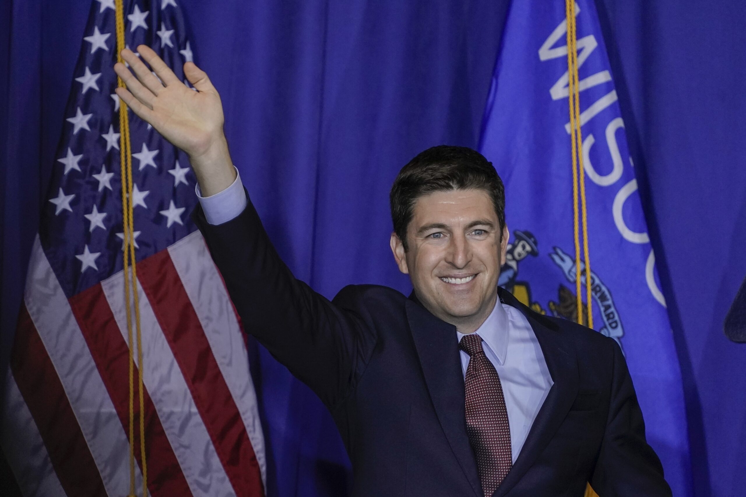 Rep. Bryan Steil waves at a campaign stop for Vice President Mike Pence