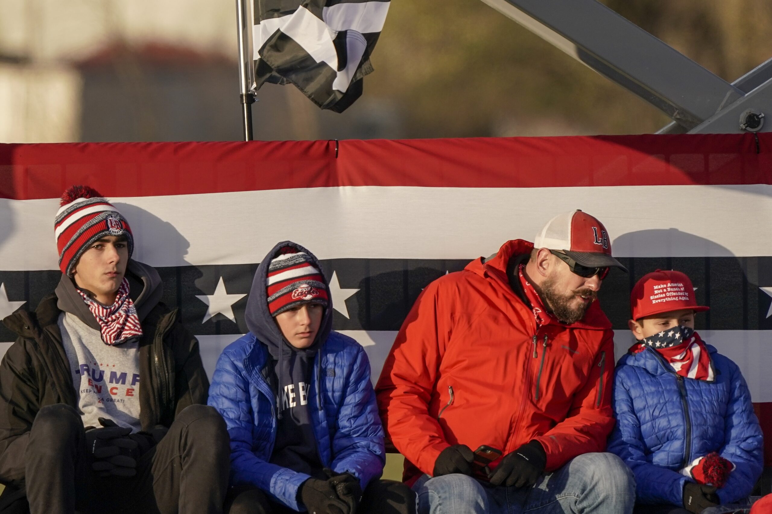 Supporters wait for President Donald Trump to speak at a campaign rally