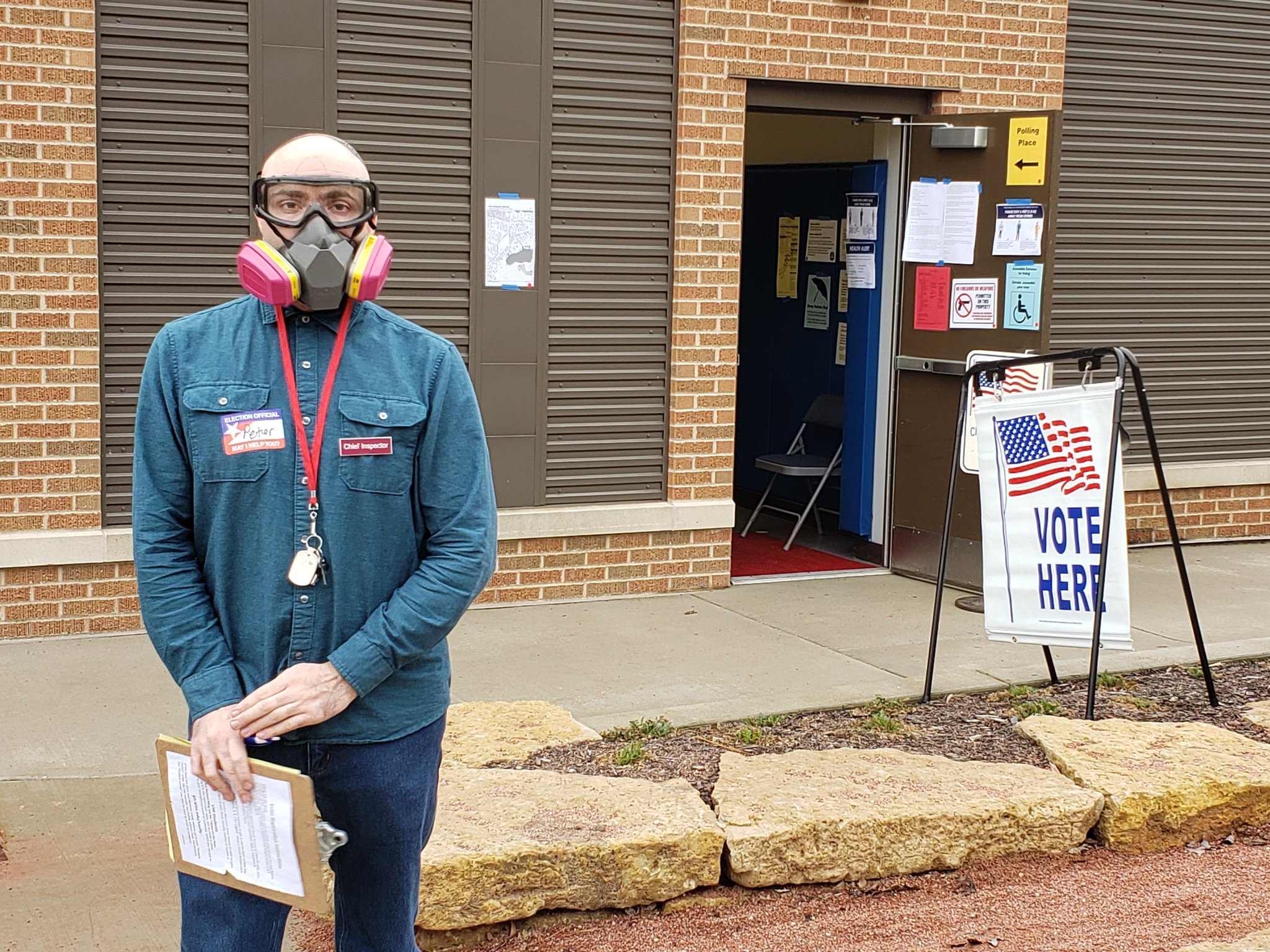 A poll worker in Madison works the polls amid the COVID-19 pandemic