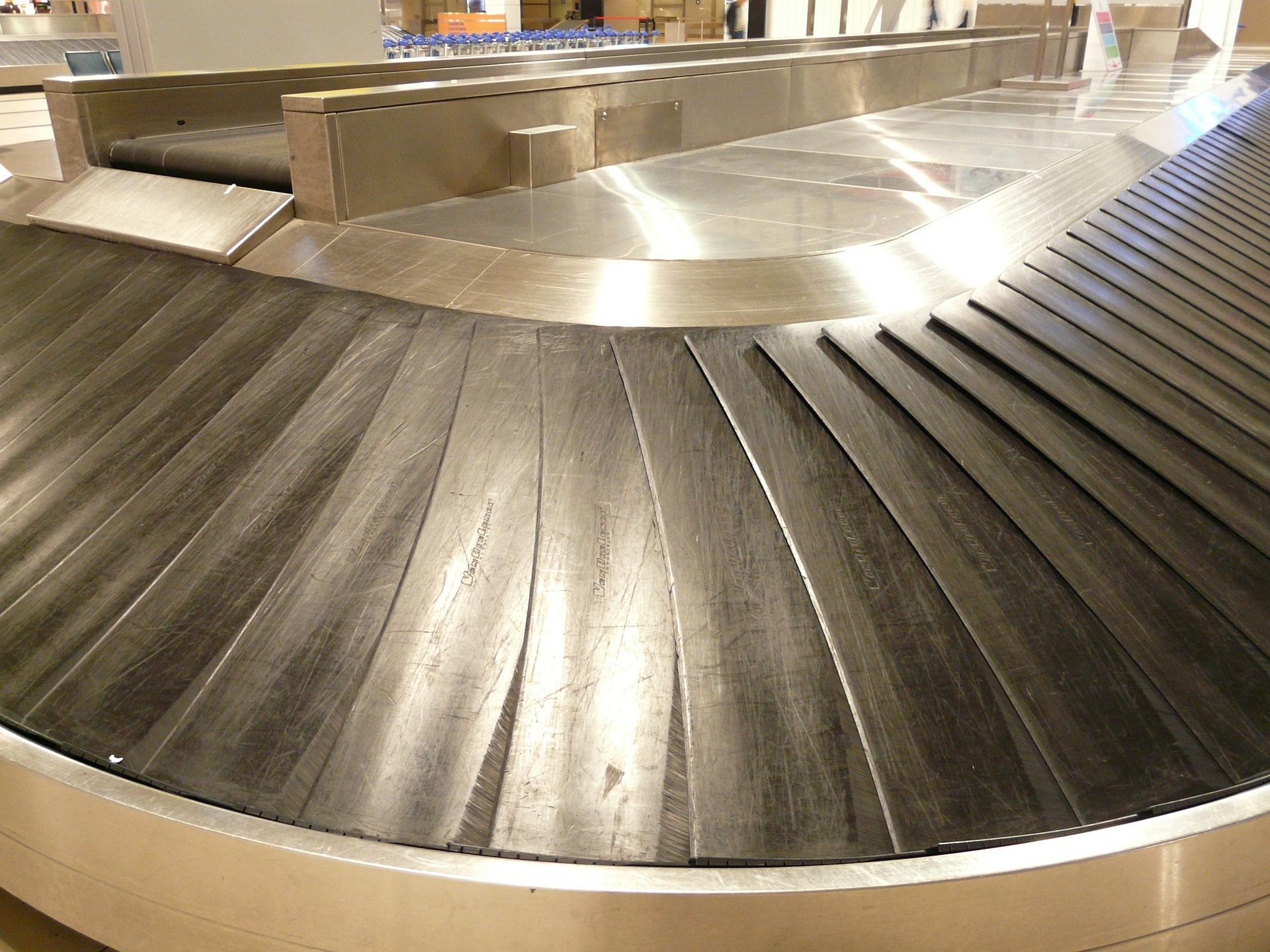 Empty luggage carousel in airport.