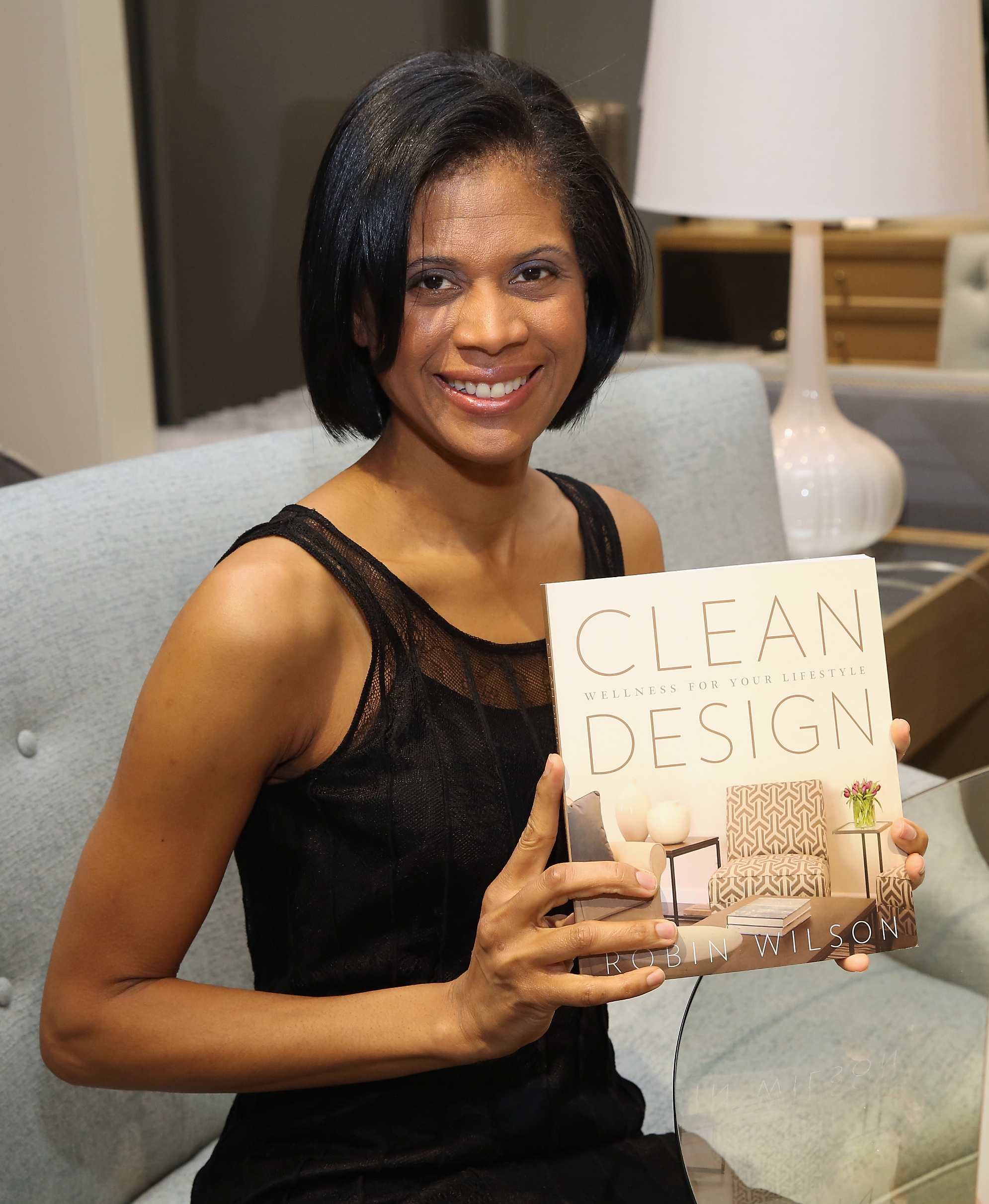 Robin Wilson poses with her book, 