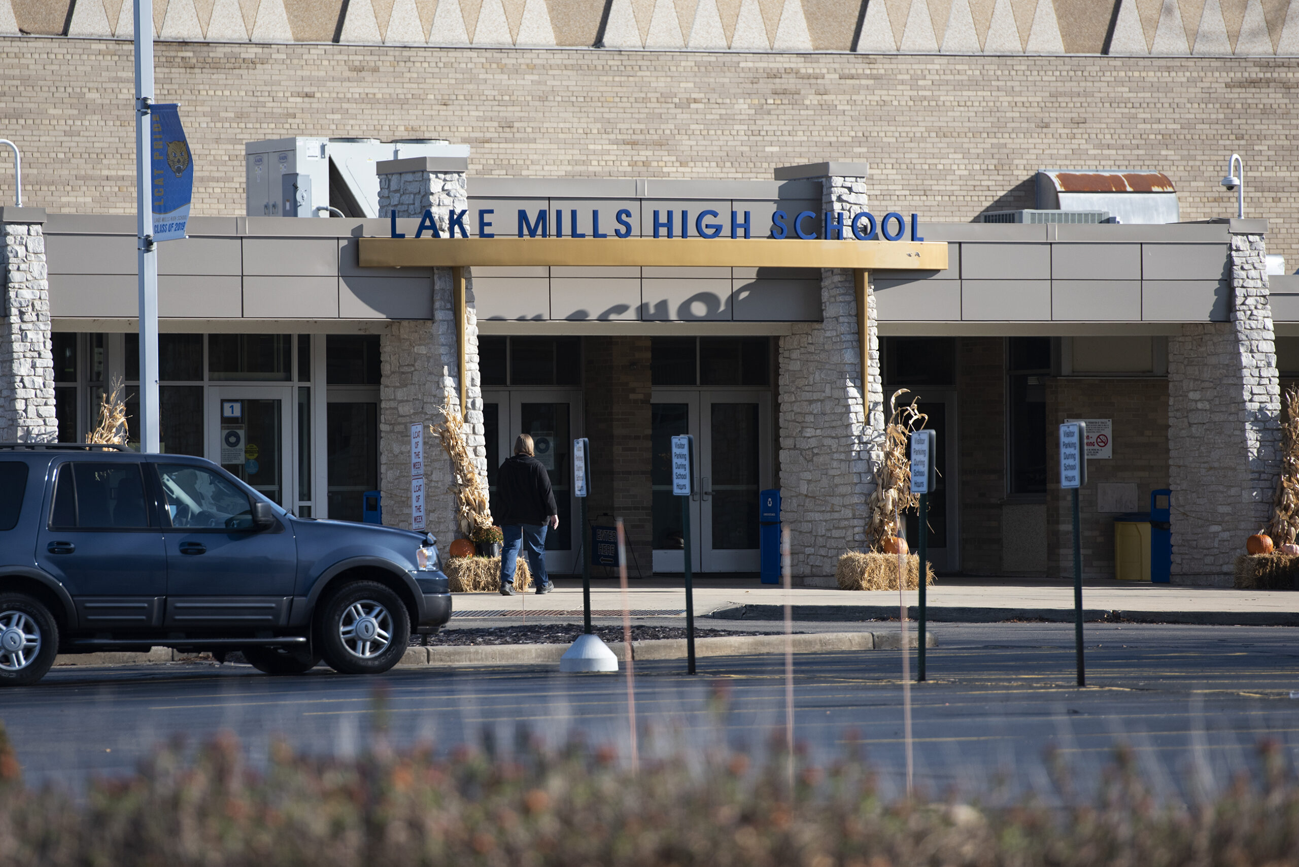 The front of Lake Mills High School is labeled with a sign