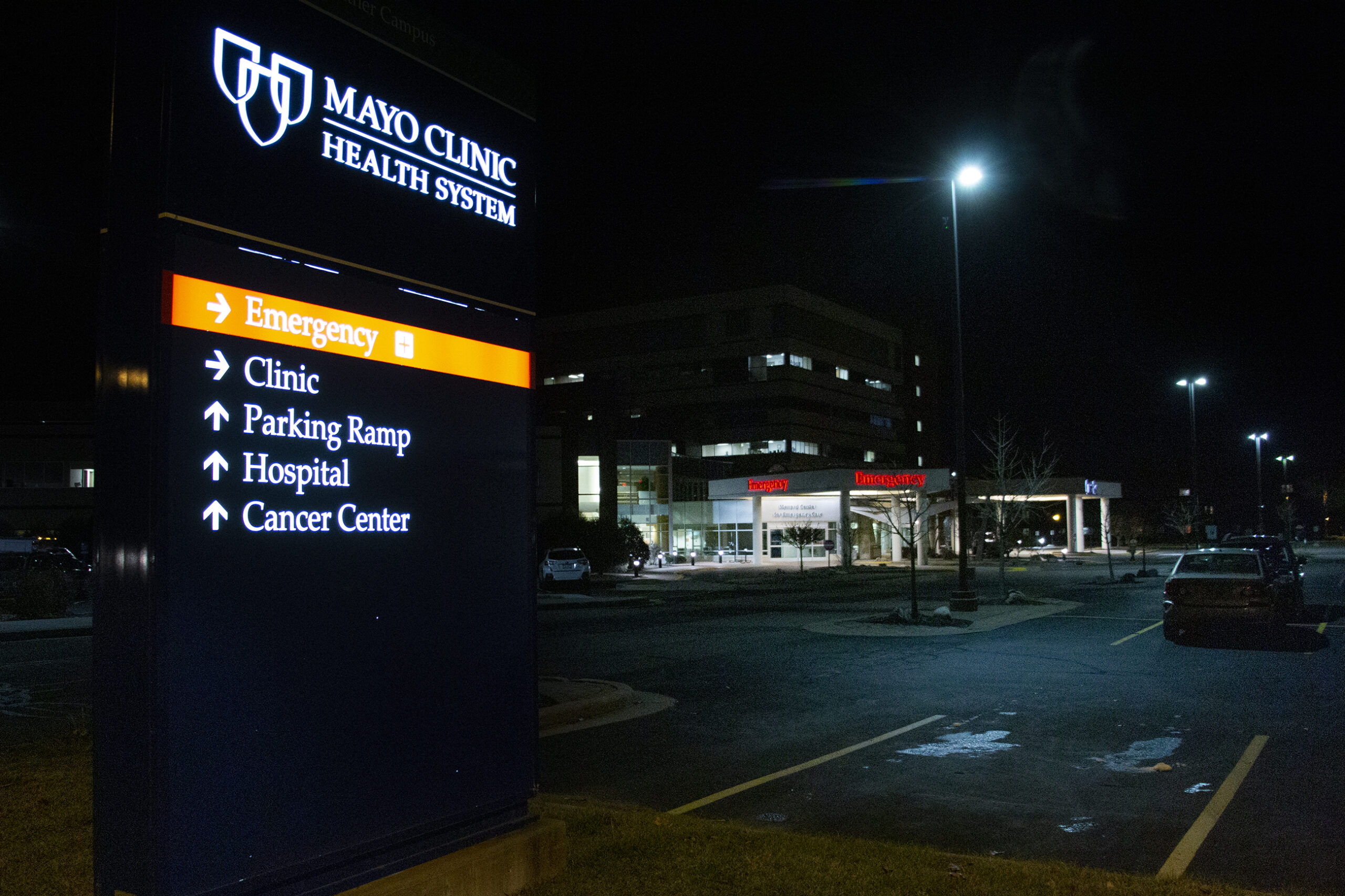 Street lights shine on the Mayo Clinic parking lot at night
