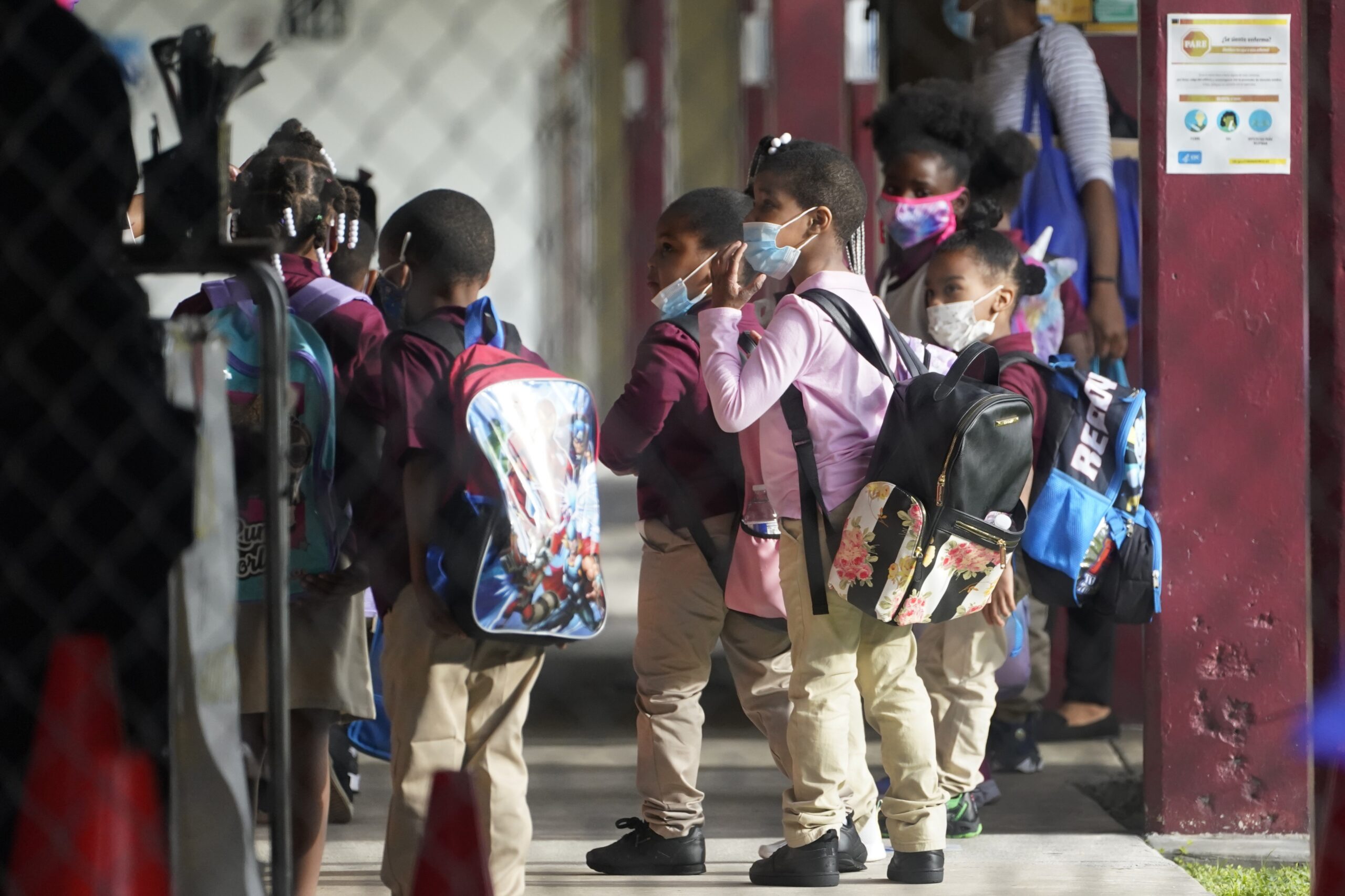 Children wait to enter classrooms