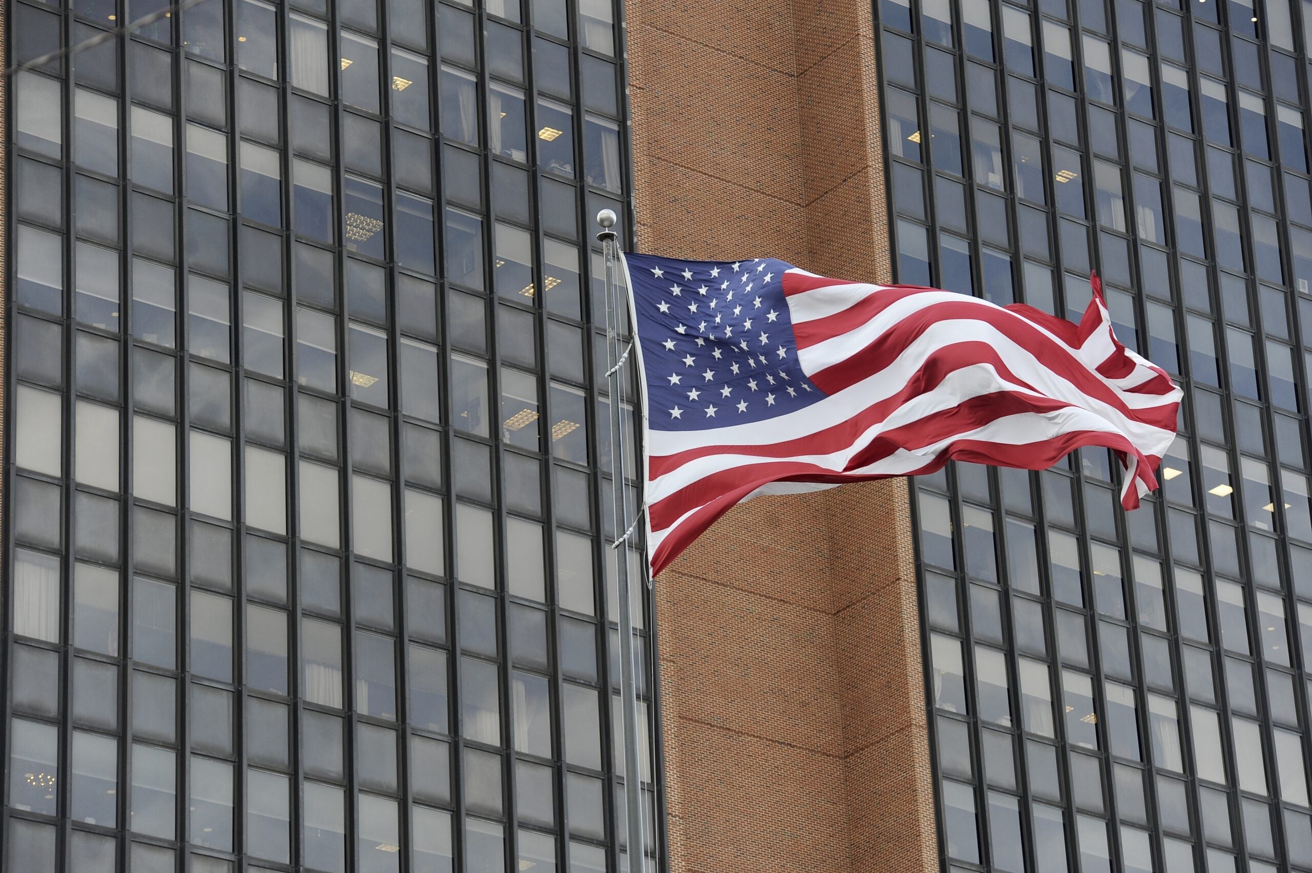 The American flag is seen at the James A. Byrne United States Courthouse