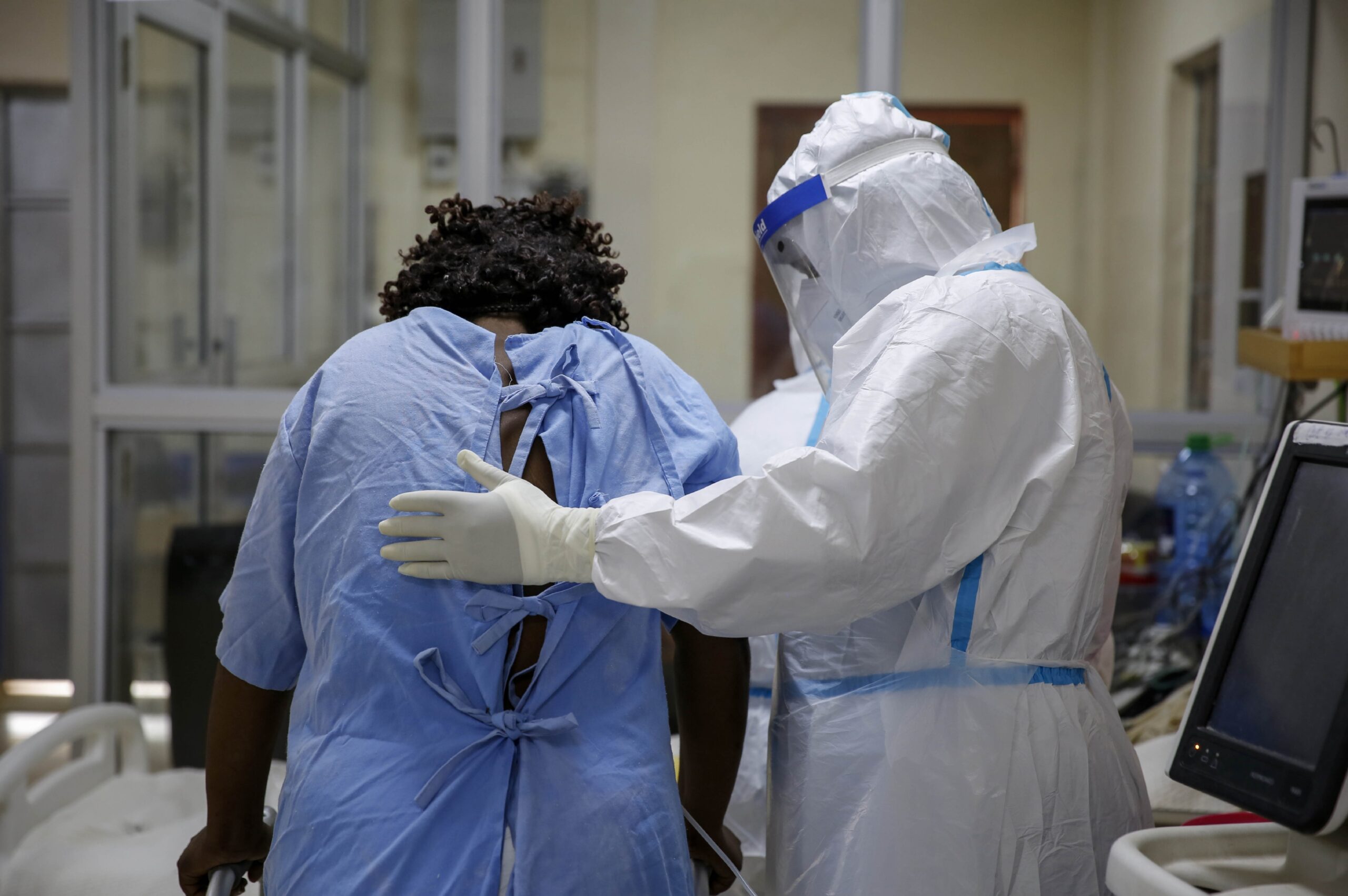 A medical worker attends to a coronavirus patient in the intensive care unit