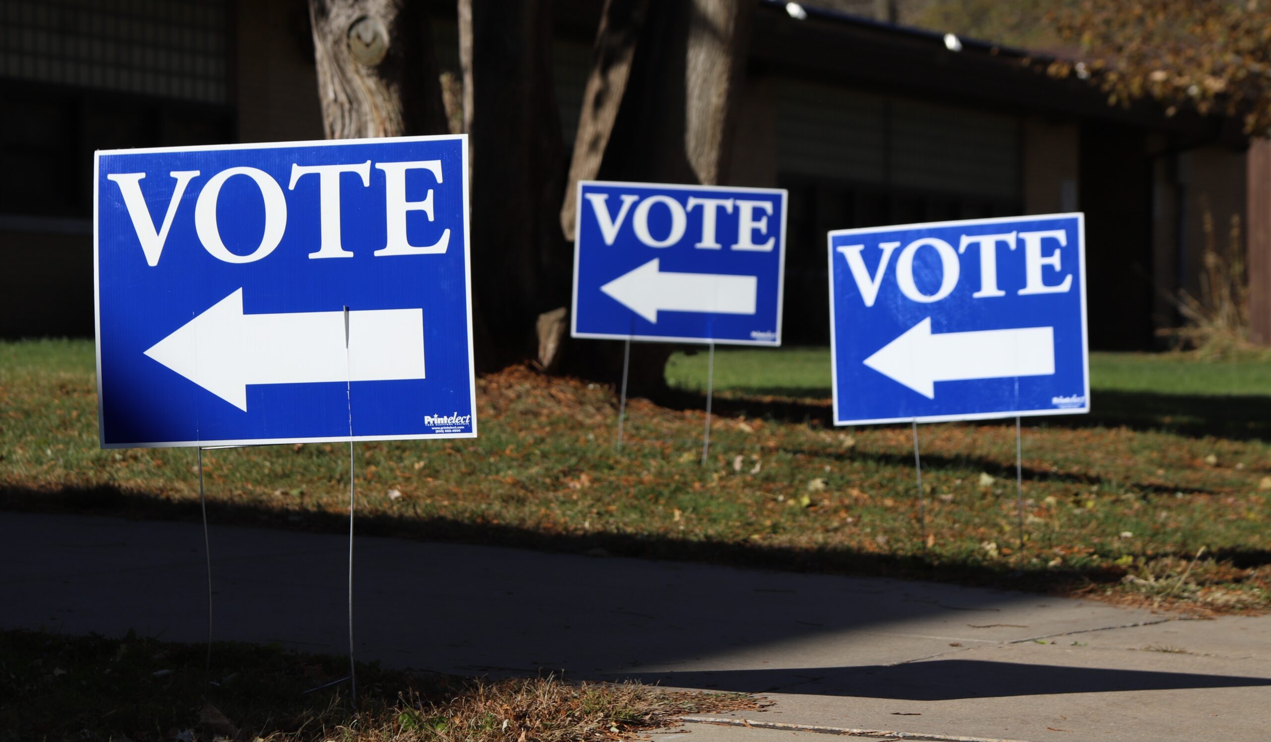 Signs telling voters where to enter the Mendota Elementary School polling place on Madison's north side