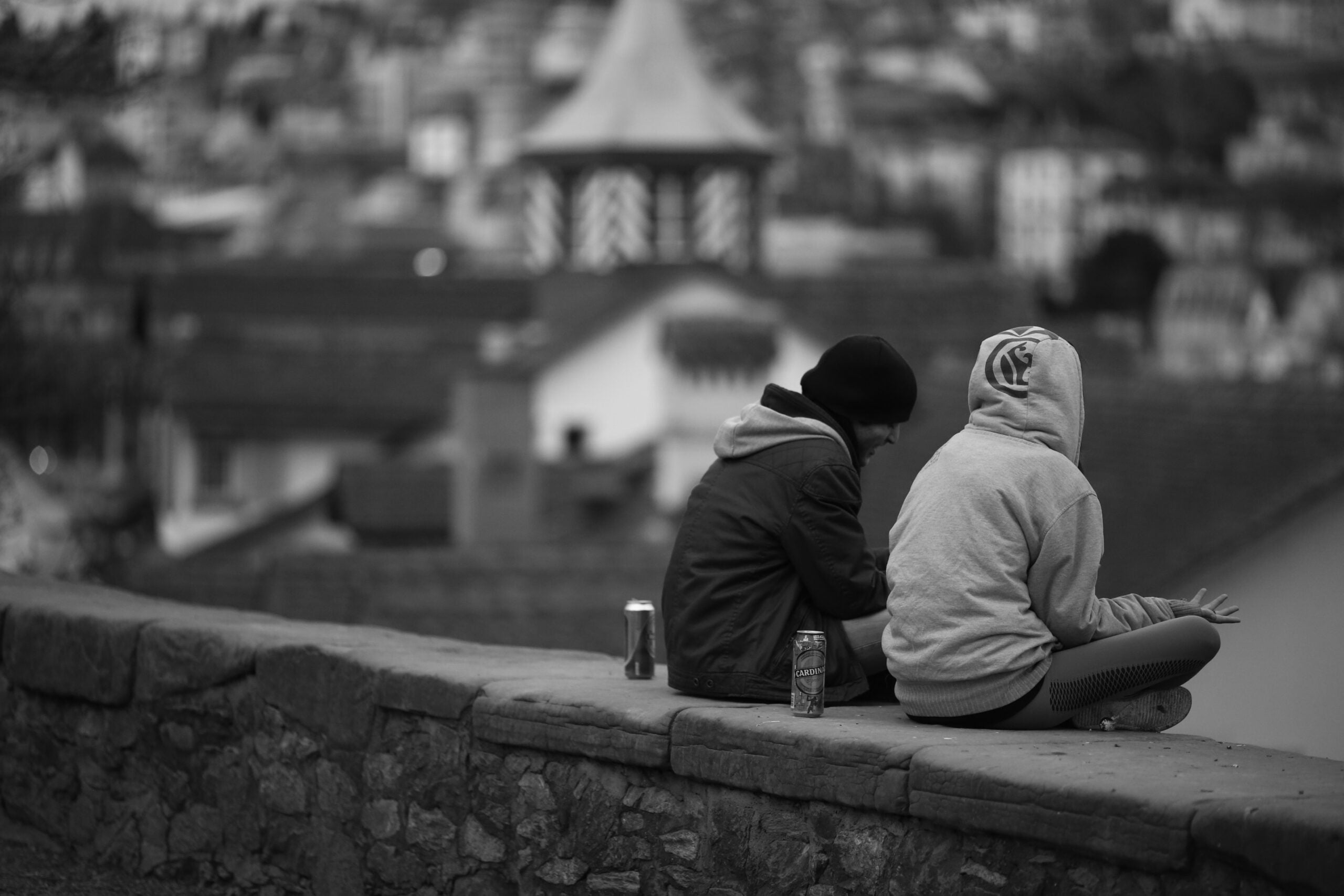 Friends sitting on a ledge