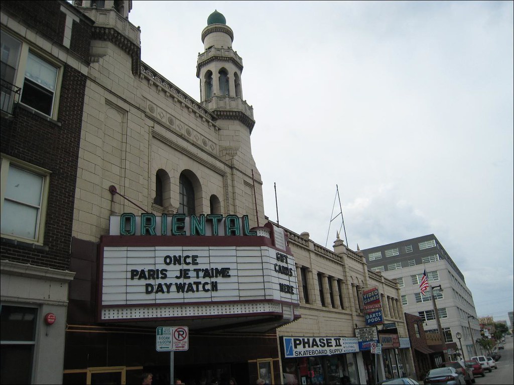 A view of the front of the Oriental Theatre building in Milwaukee with original sign display.