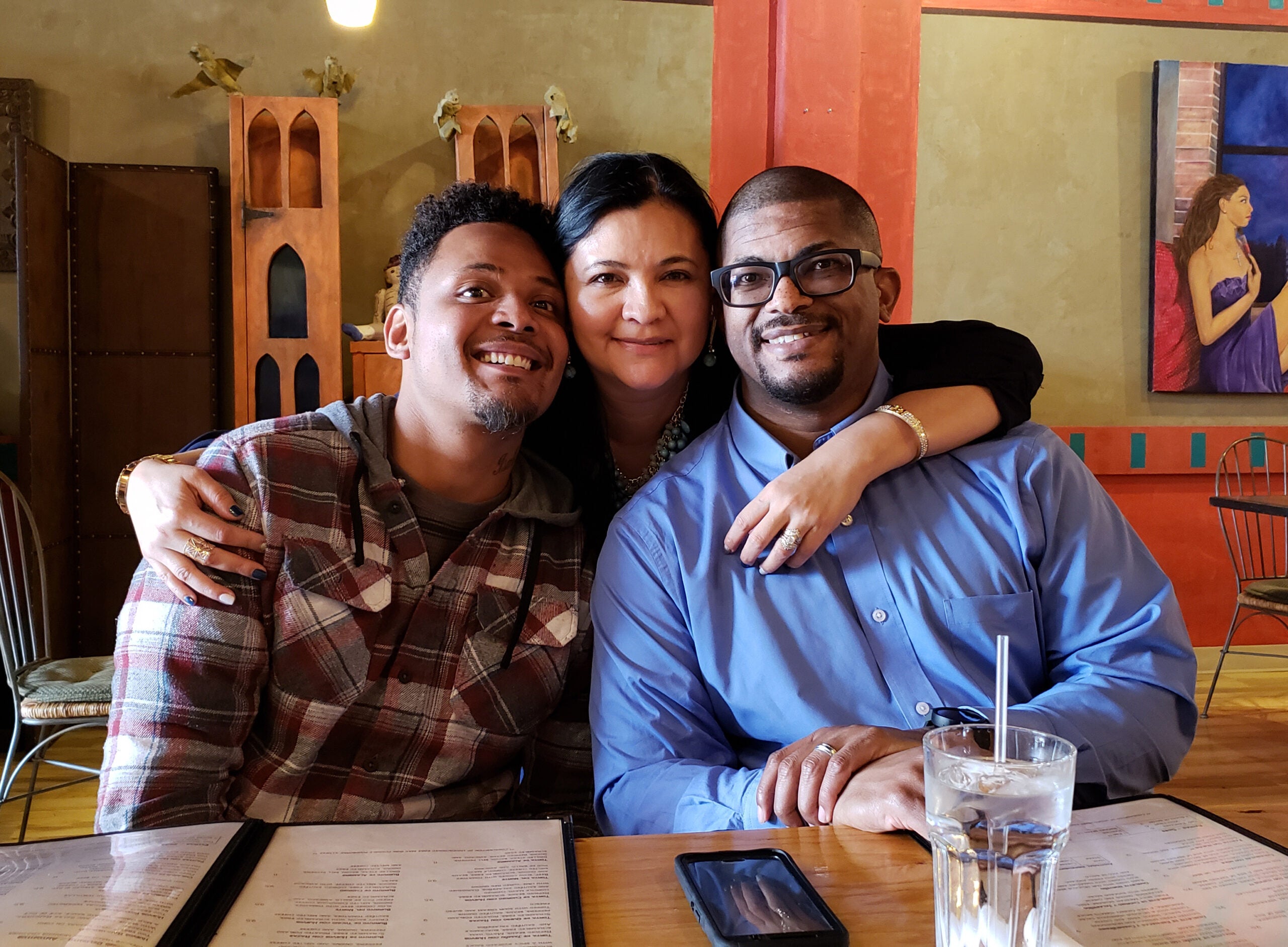 Brandon Cullins, left, with his parents Jackie and Robert Watson
