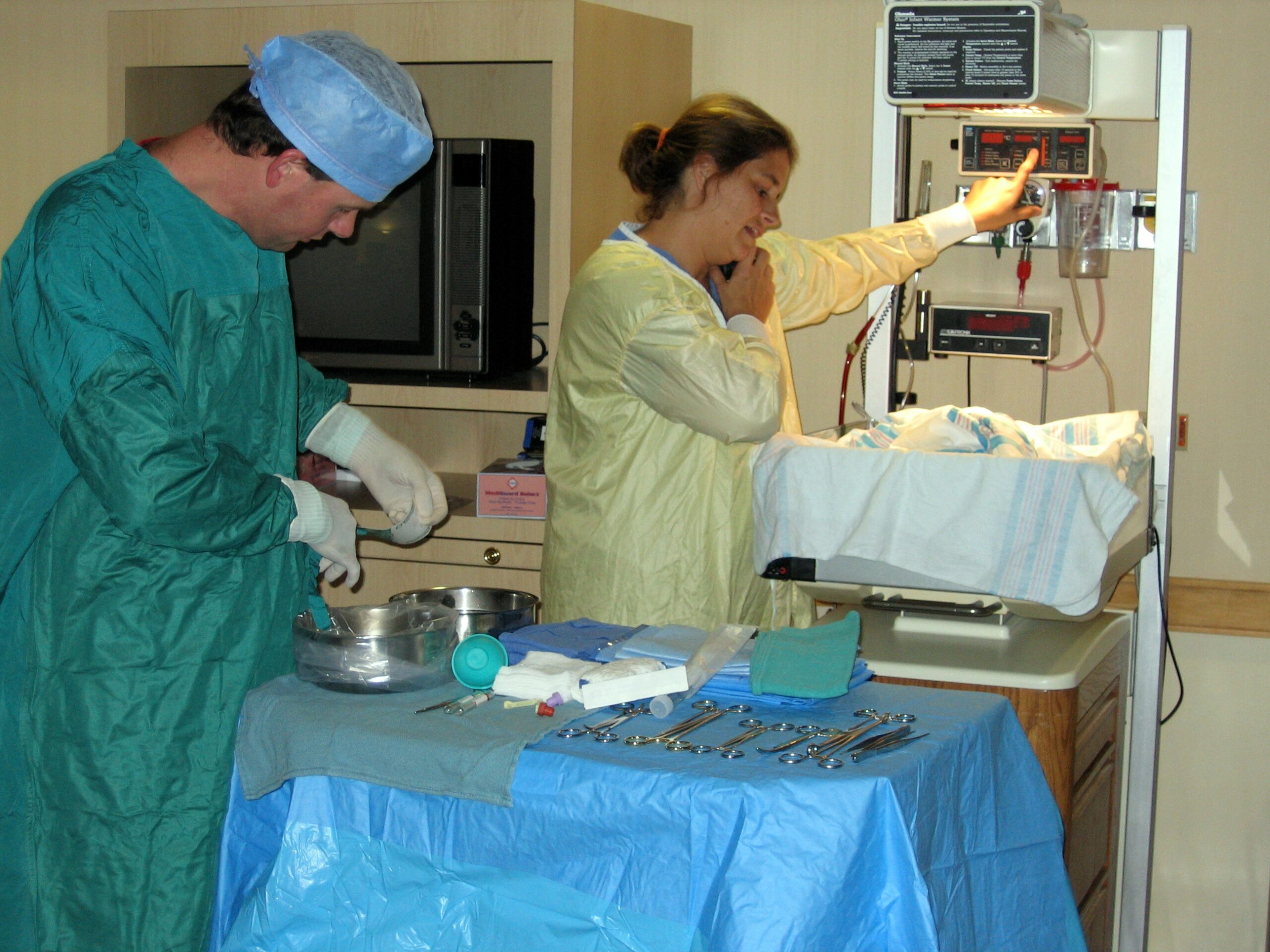 Healthcare providers preparing for a procedure.