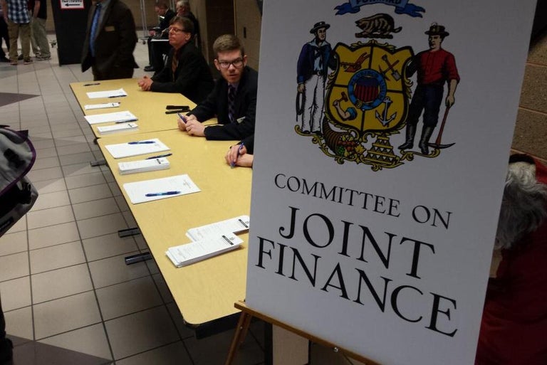 A poster with the Wisconsin crest that reads Committee on Joint Finance