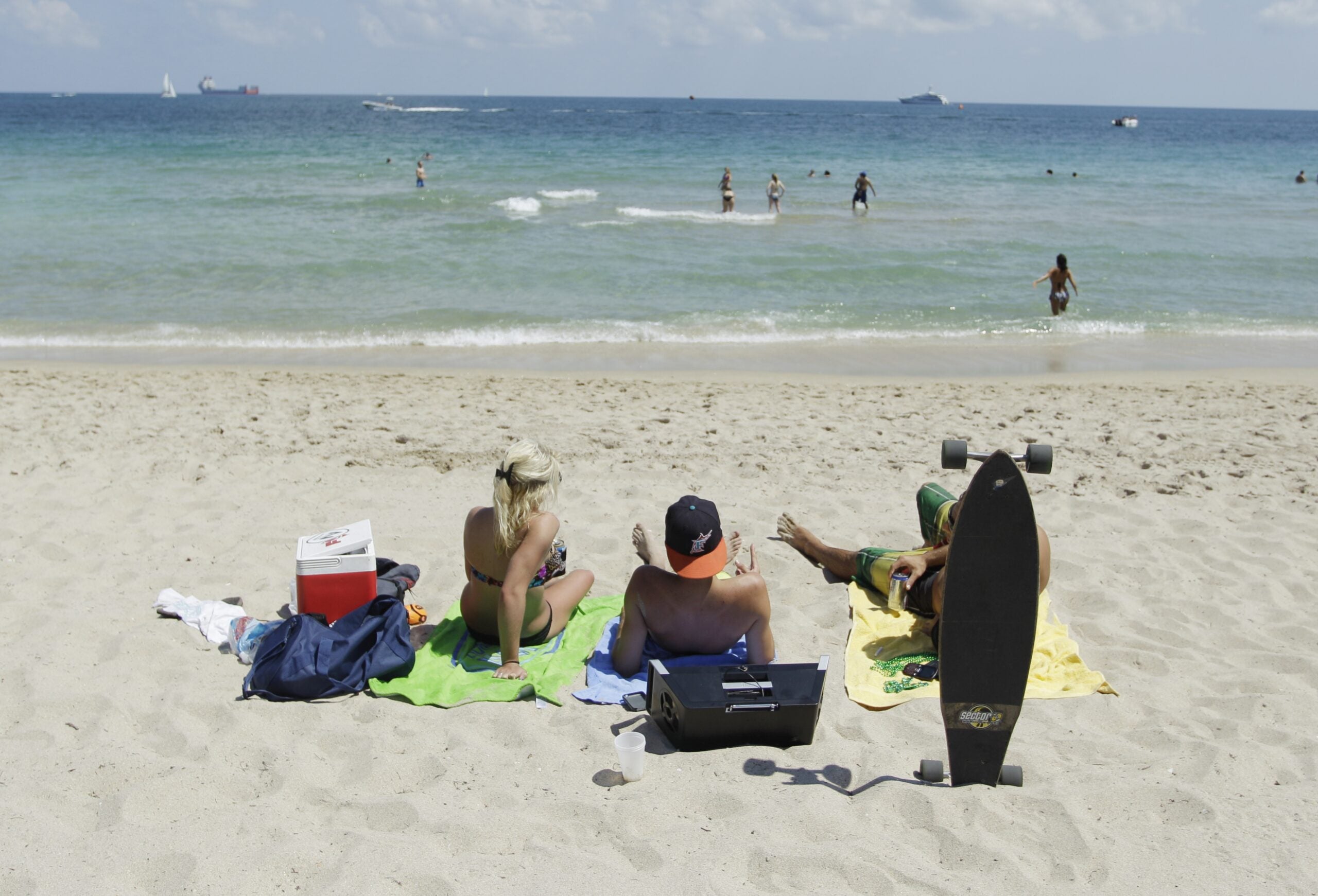 A group of students enjoy the warm weather and sand at Fort Lauderdale