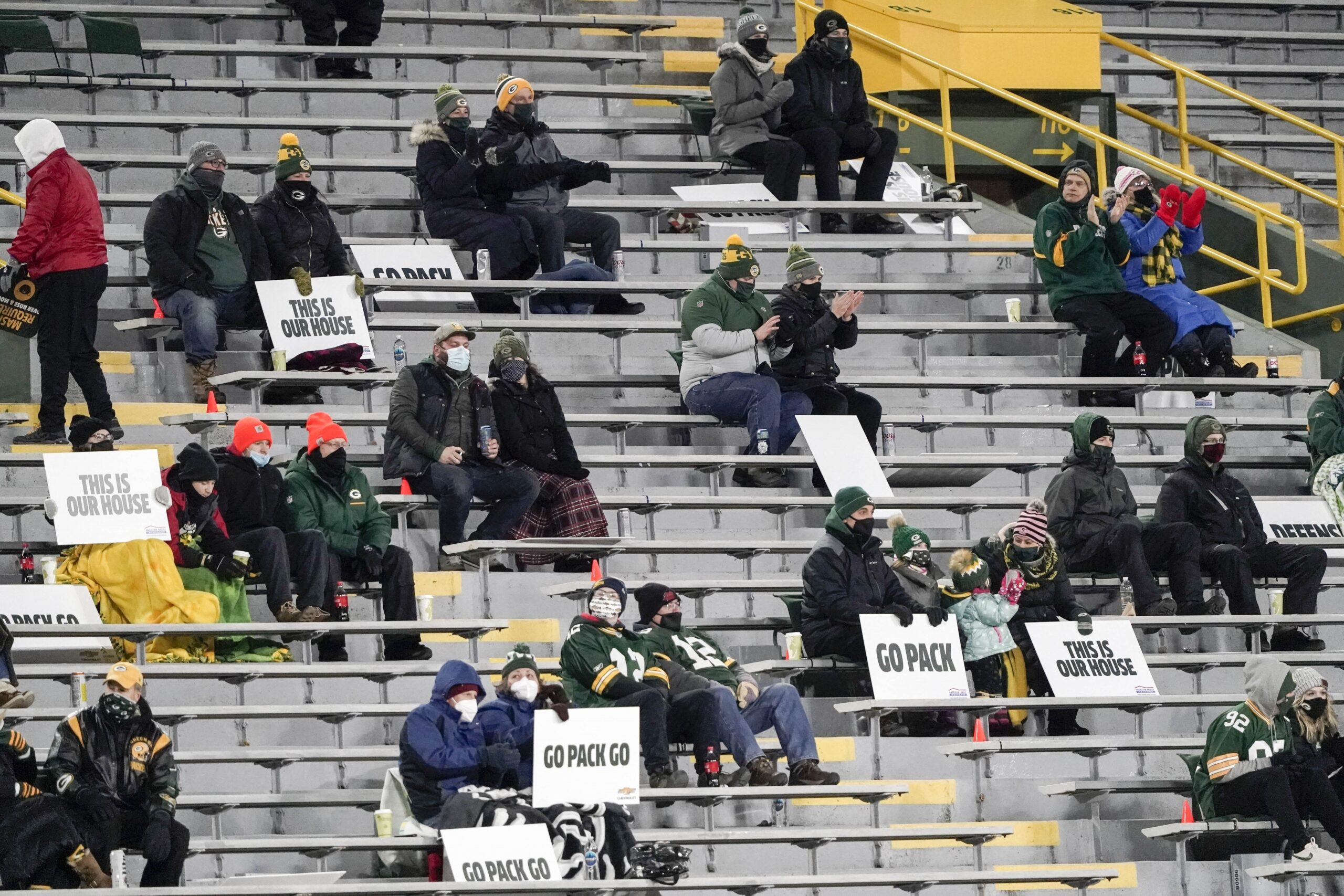 A limited number of fans at Lambeau Field watch a Green Bay Packers game