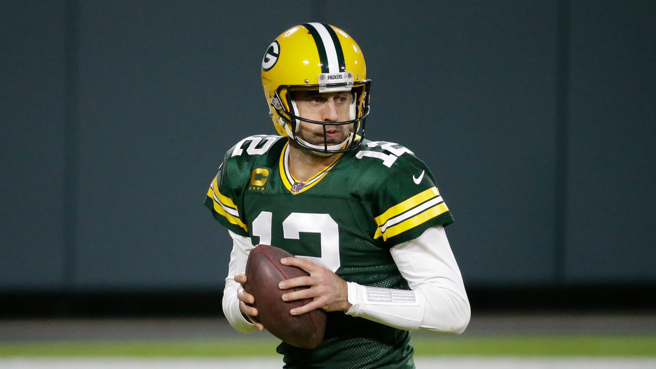 Green Bay Packers' Aaron Rodgers drops back during the second half of an NFL football game