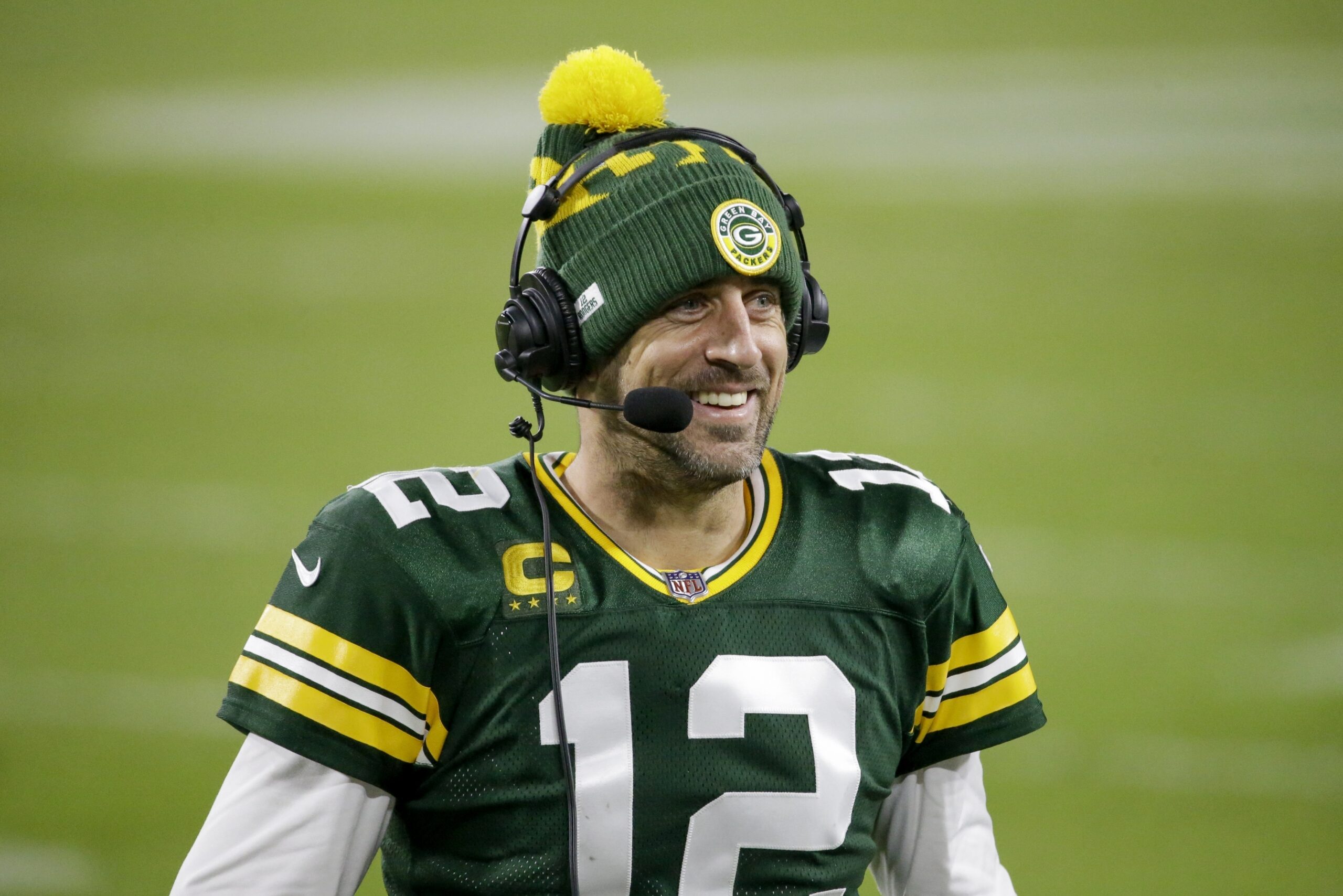 Green Bay Packers' Aaron Rodgers smiles as he is interviewed after an NFL football game