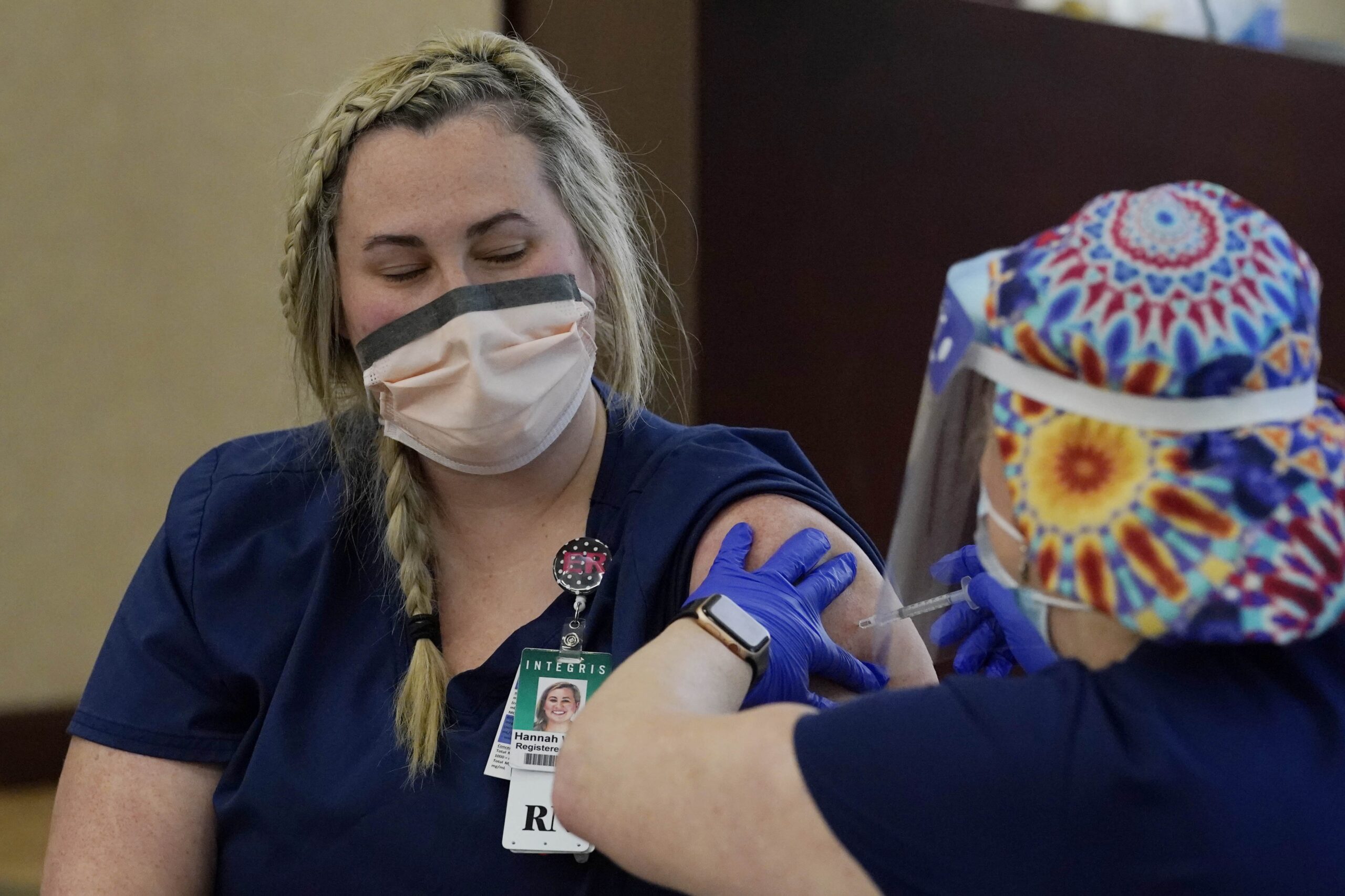 a registered nurse becomes the first person in Oklahoma to receive Pfizer's coronavirus vaccine