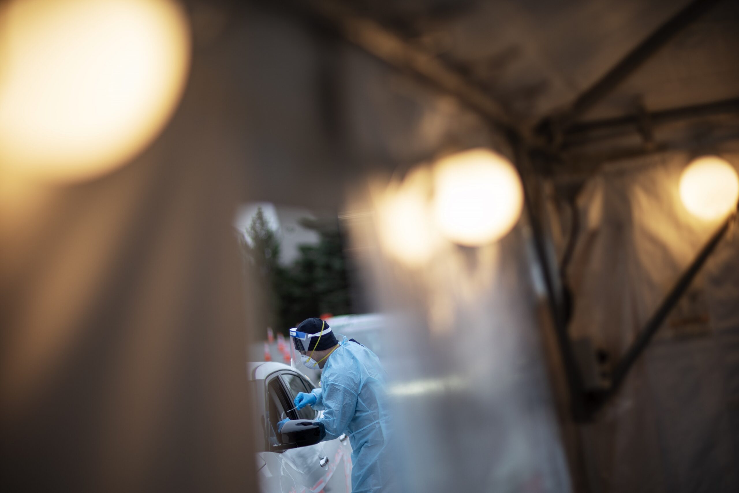 A motorist is tested for COVID-19