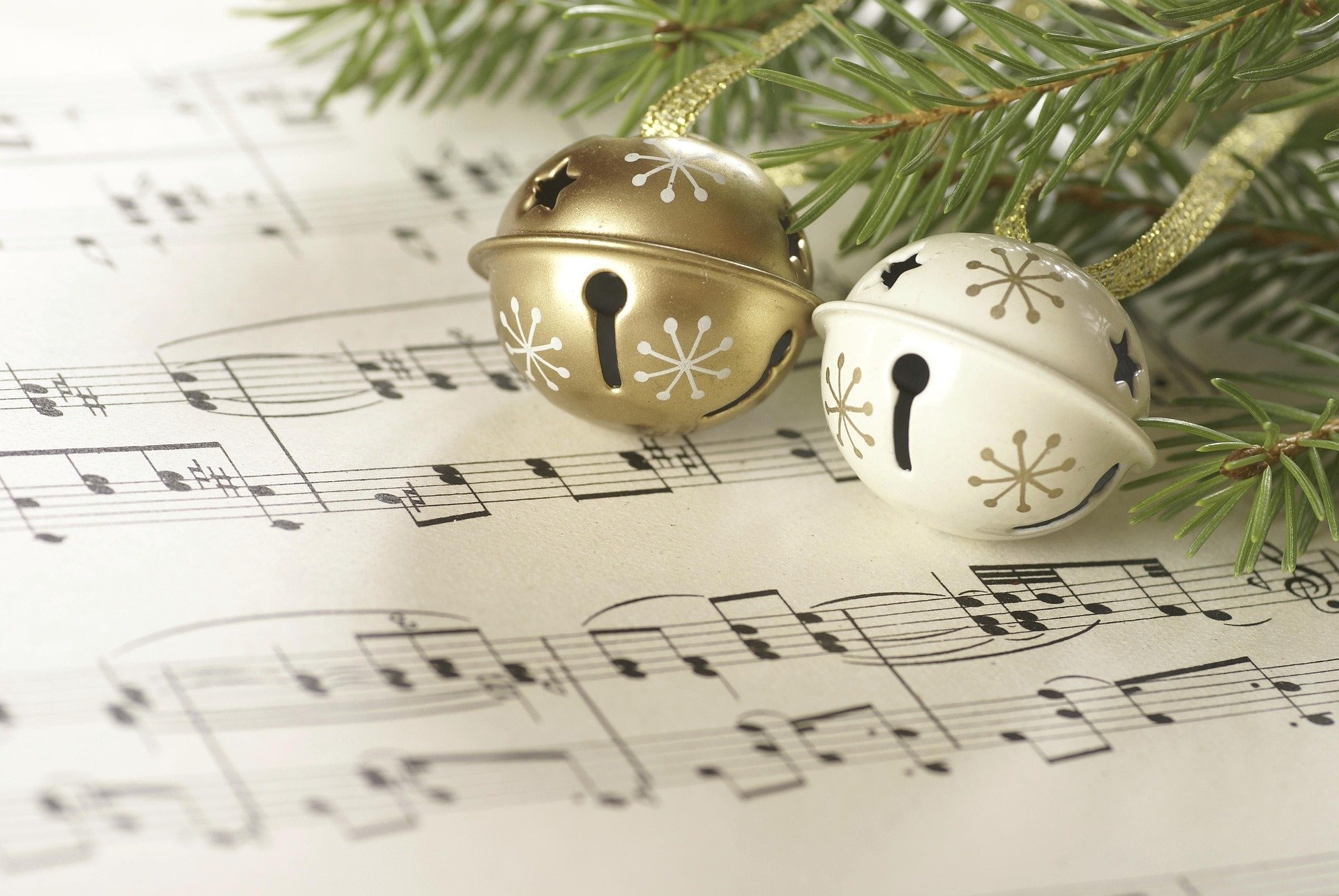 Bells and evergreens on sheet music.