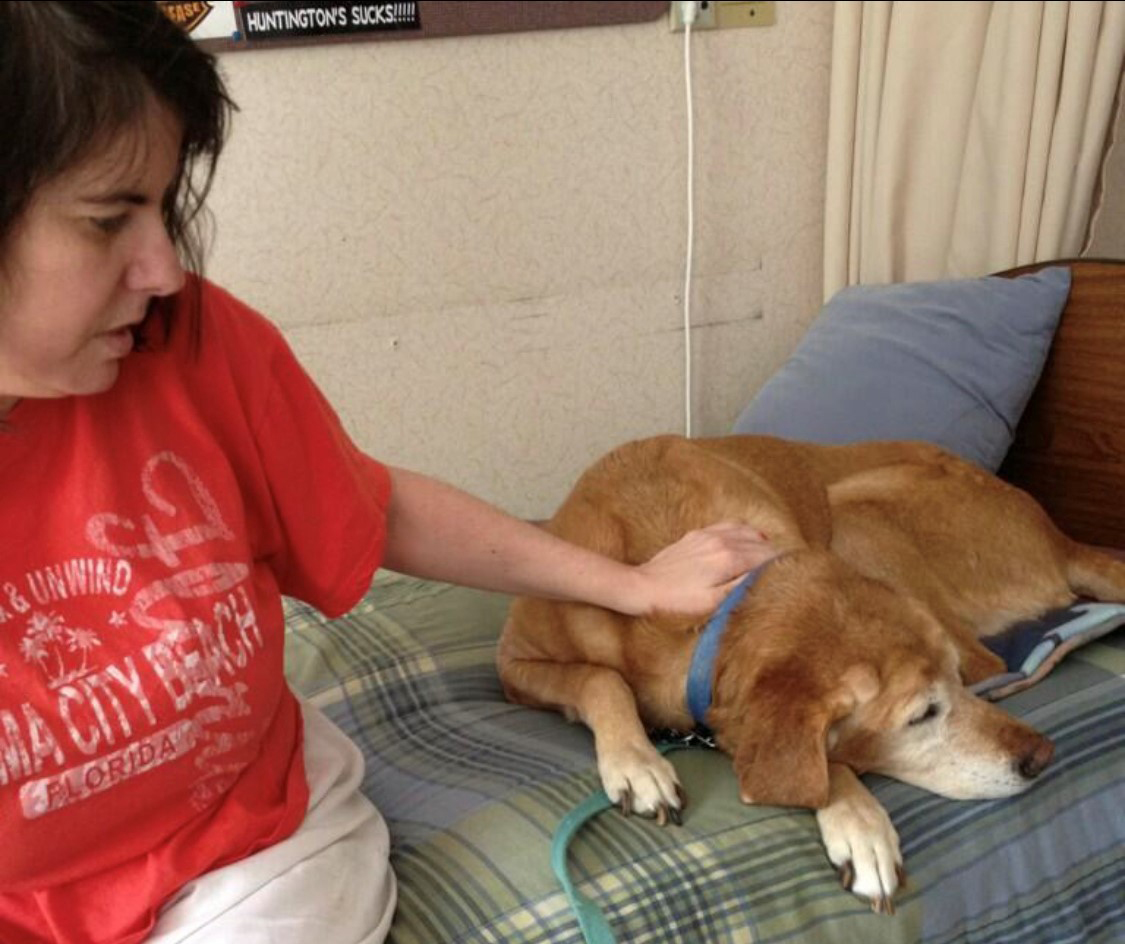 Kelly Kobriger visits her mom, Mary Strong, in a nursing home, with the family dog, Bailey