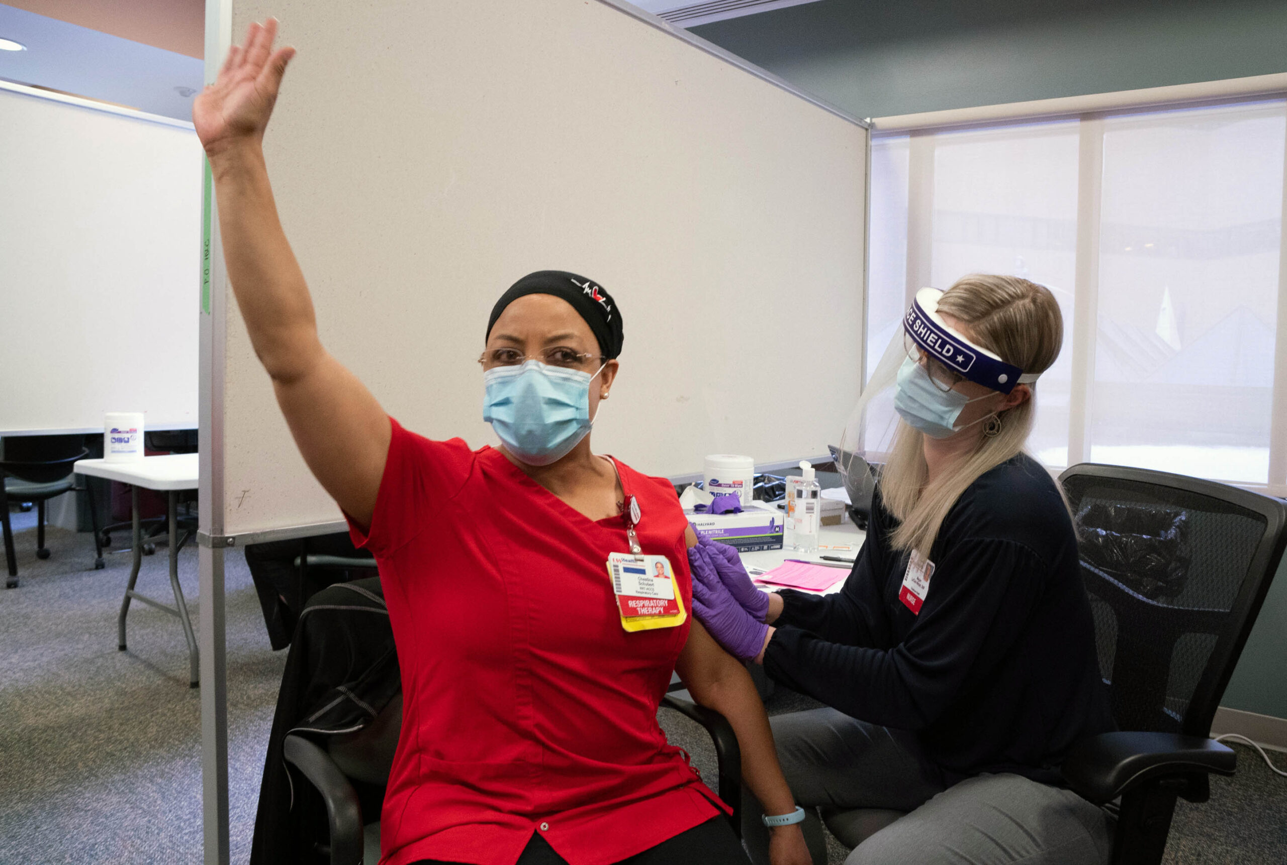 UW Health respiratory therapist Tina Schubert gets a COVID vaccine