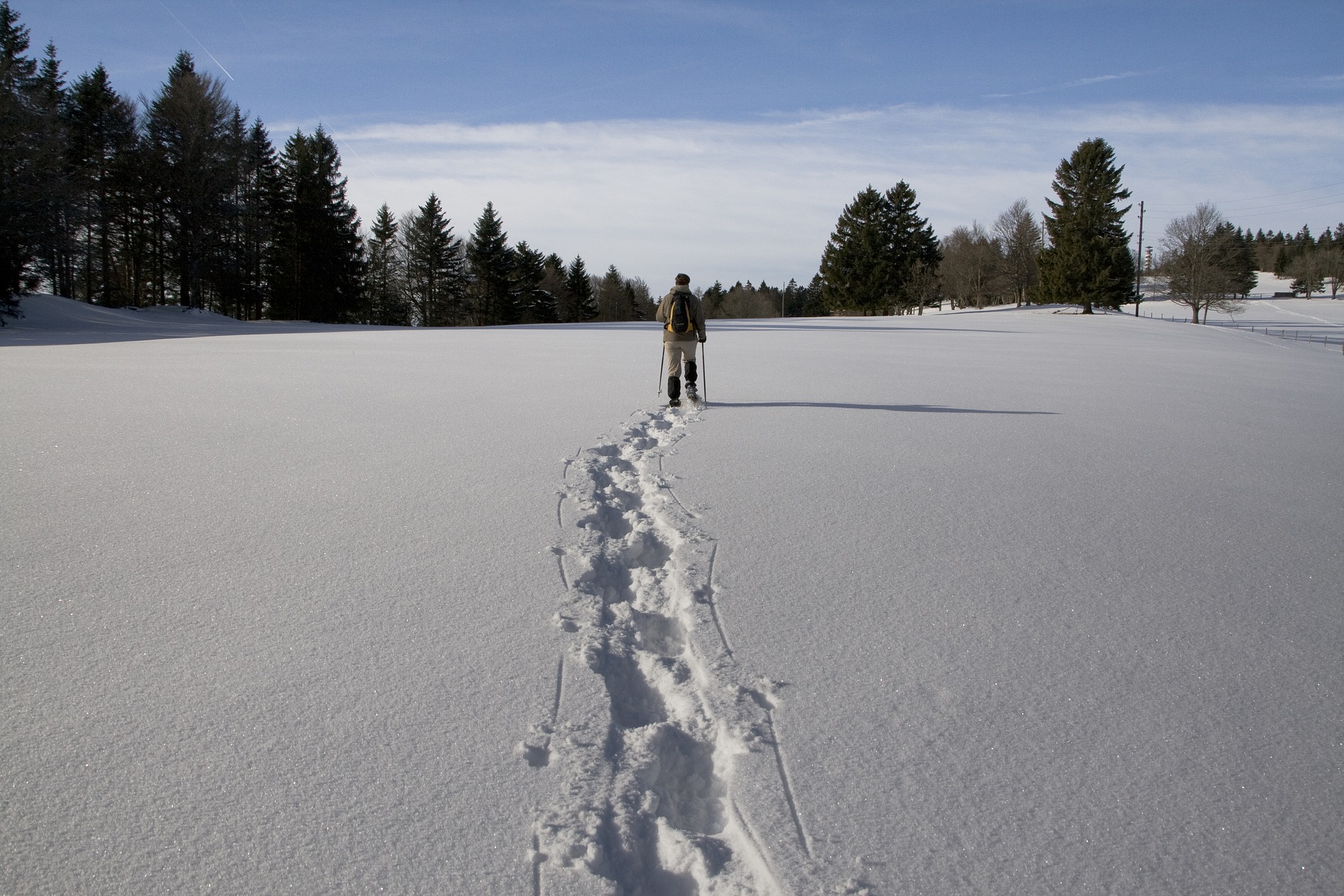 Person snowshoeing in open space
