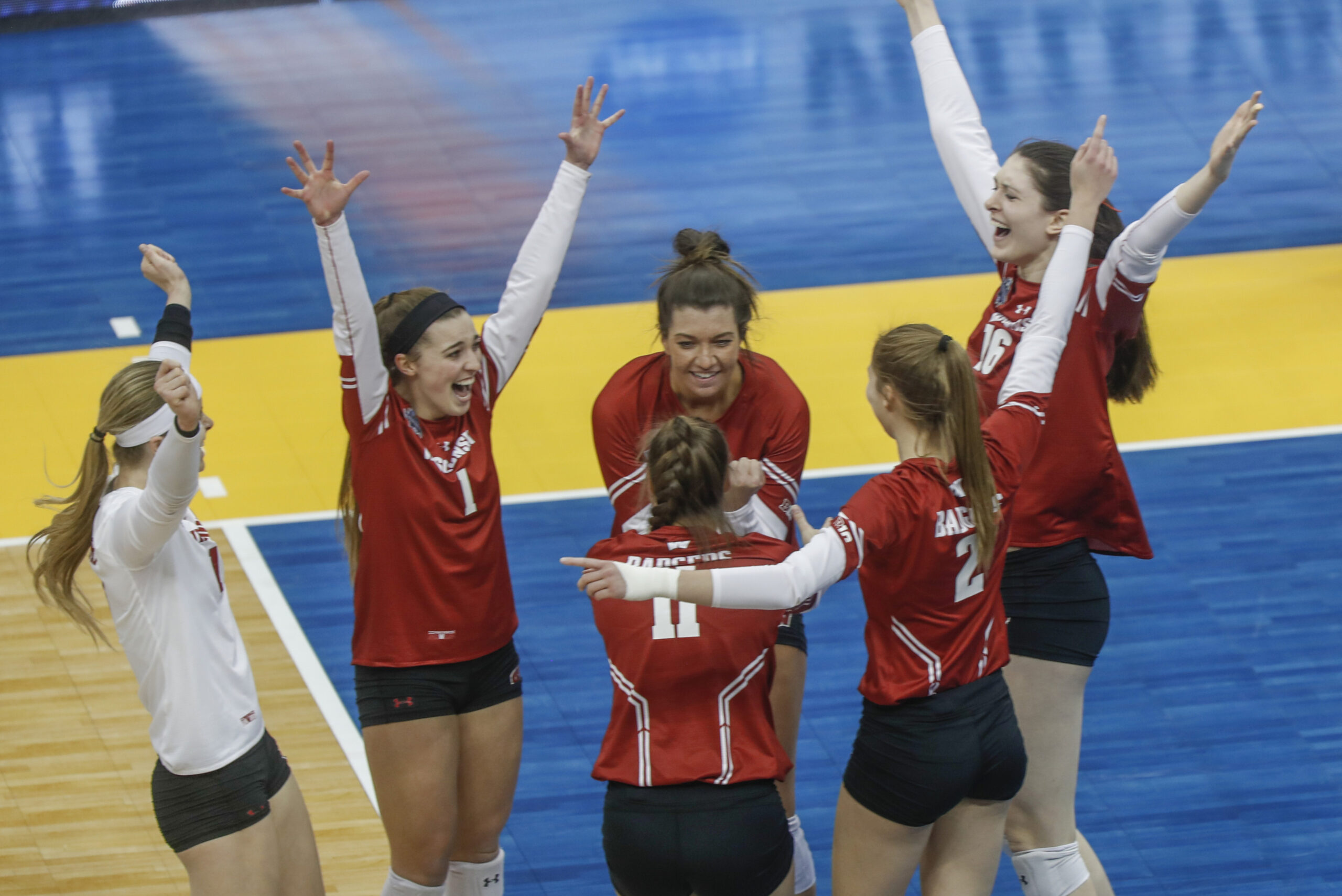 The Wisconsin team celebrates after defeating Baylor in a semifinal of the NCAA Division I women's volleyball championships, Thursday Dec. 19, 2019