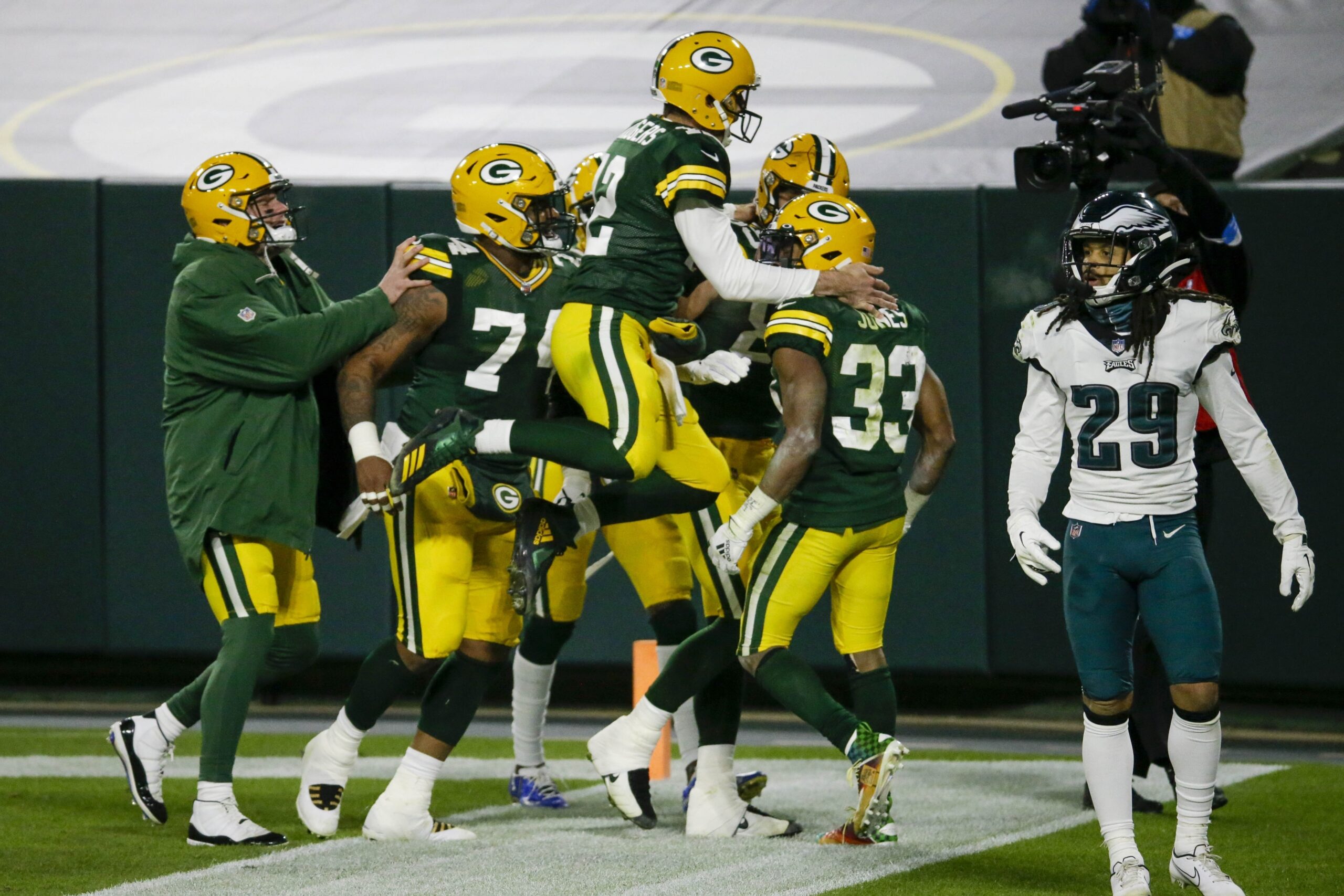 Green Bay Packers' Aaron Jones is congratulated by quarterback Aaron Rodgers