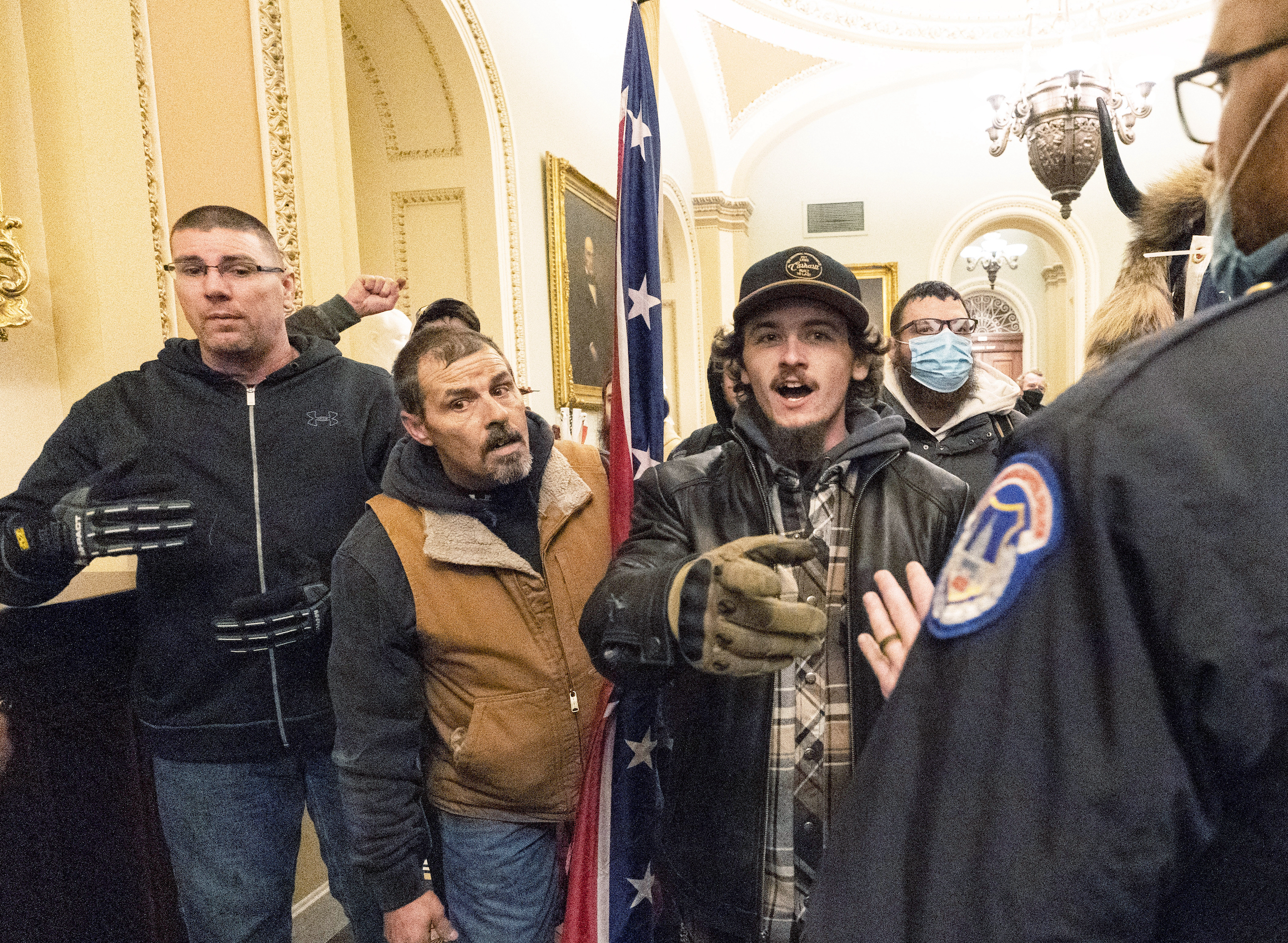 Protesters carrying a Confederate flag in the U.S. Capitol