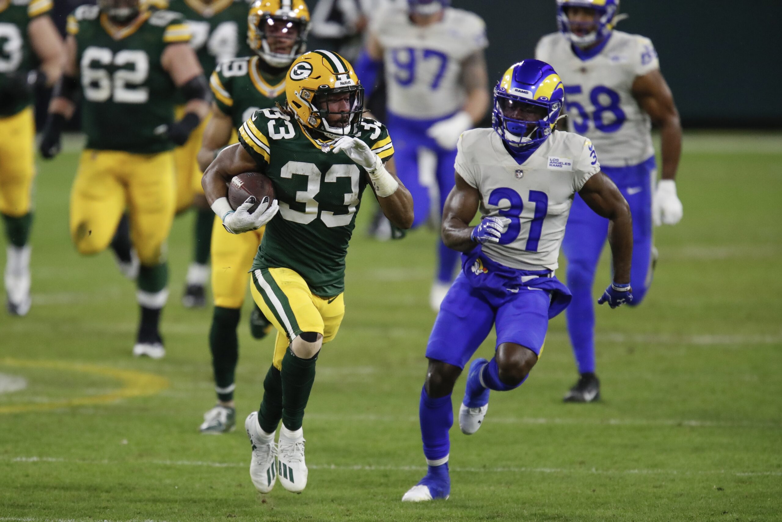 Green Bay Packers running back Aaron Jones runs the ball against the Los Angeles Rams