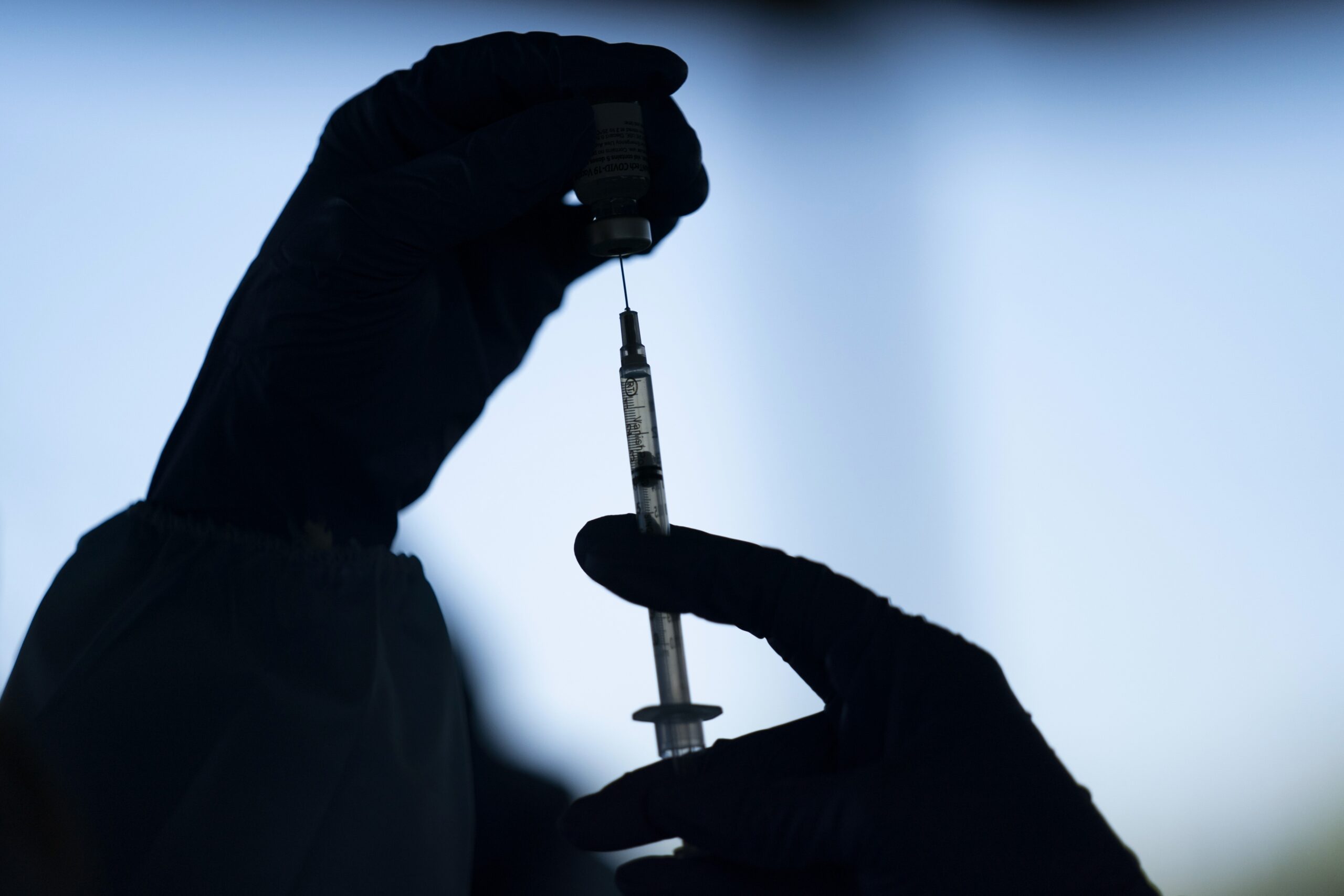A medical staff member prepares the Pfizer-BioNTech COVID-19 vaccine