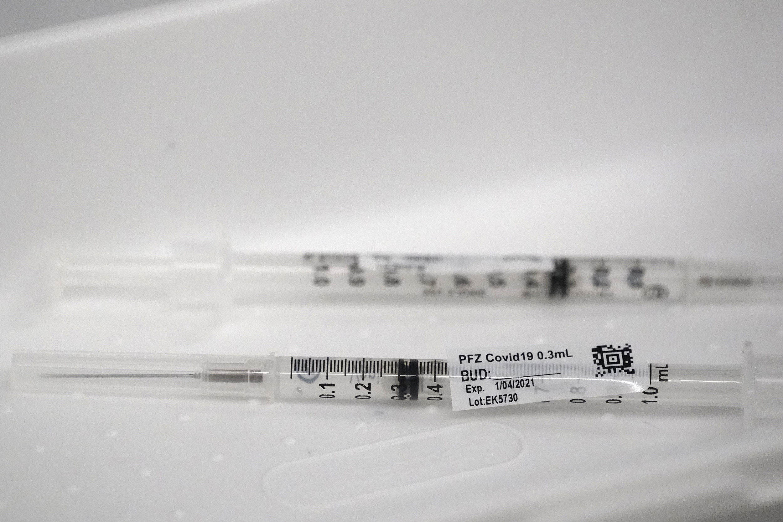 Syringes containing the Pfizer-BioNTech COVID-19 vaccine