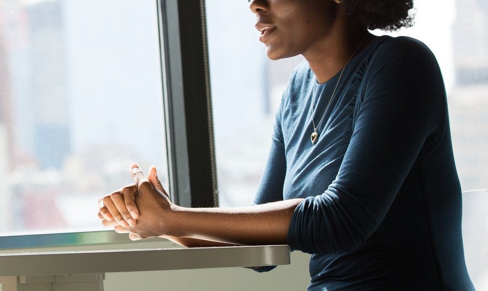 Woman sits at a table
