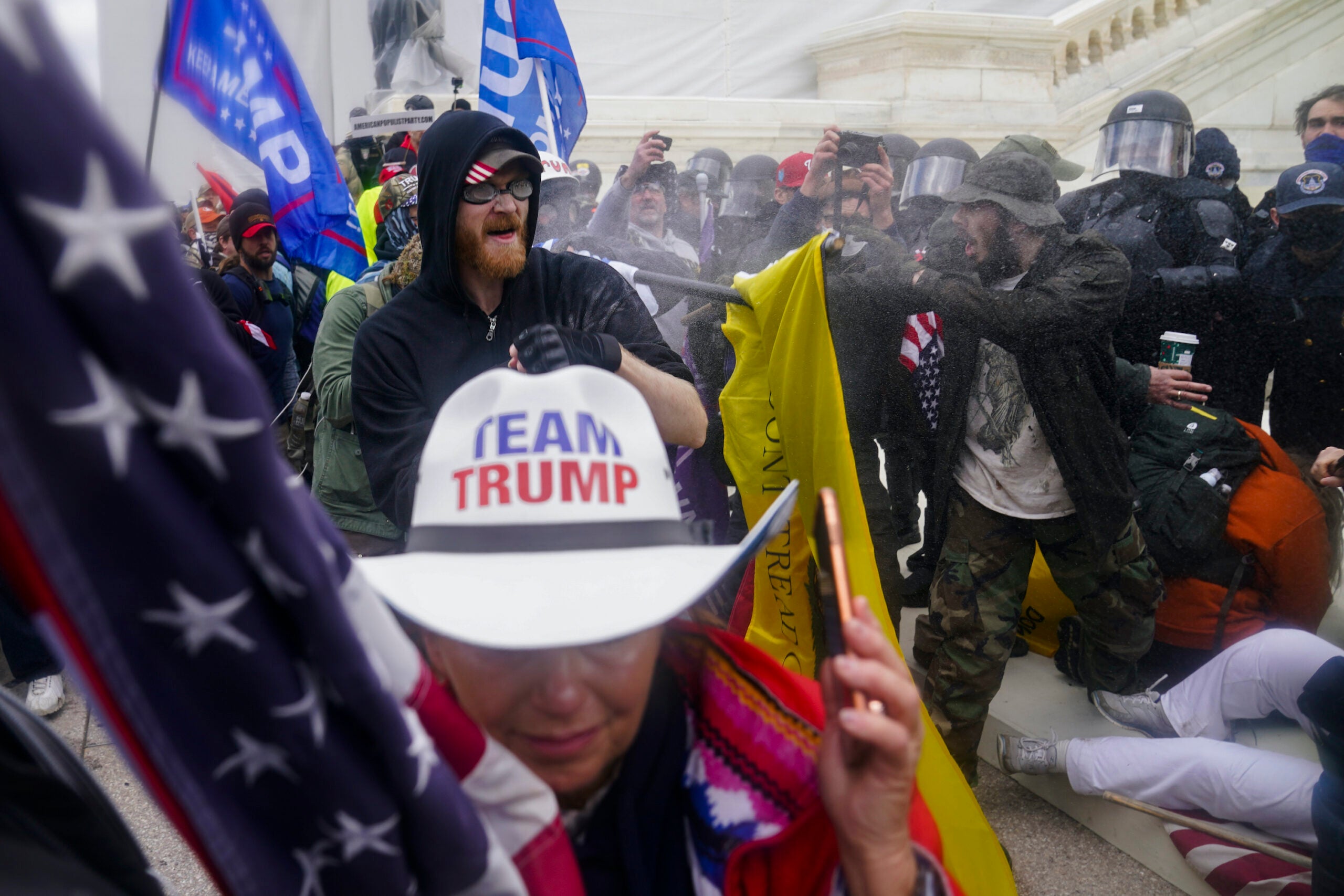 In this Jan. 6, 2021, file photo, Trump supporters try to break through a police barrier at the Capitol in Washington.