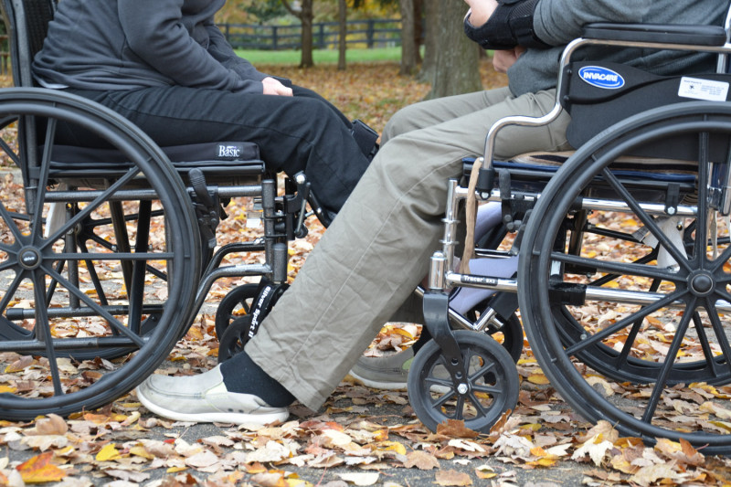 Two people in wheelchairs
