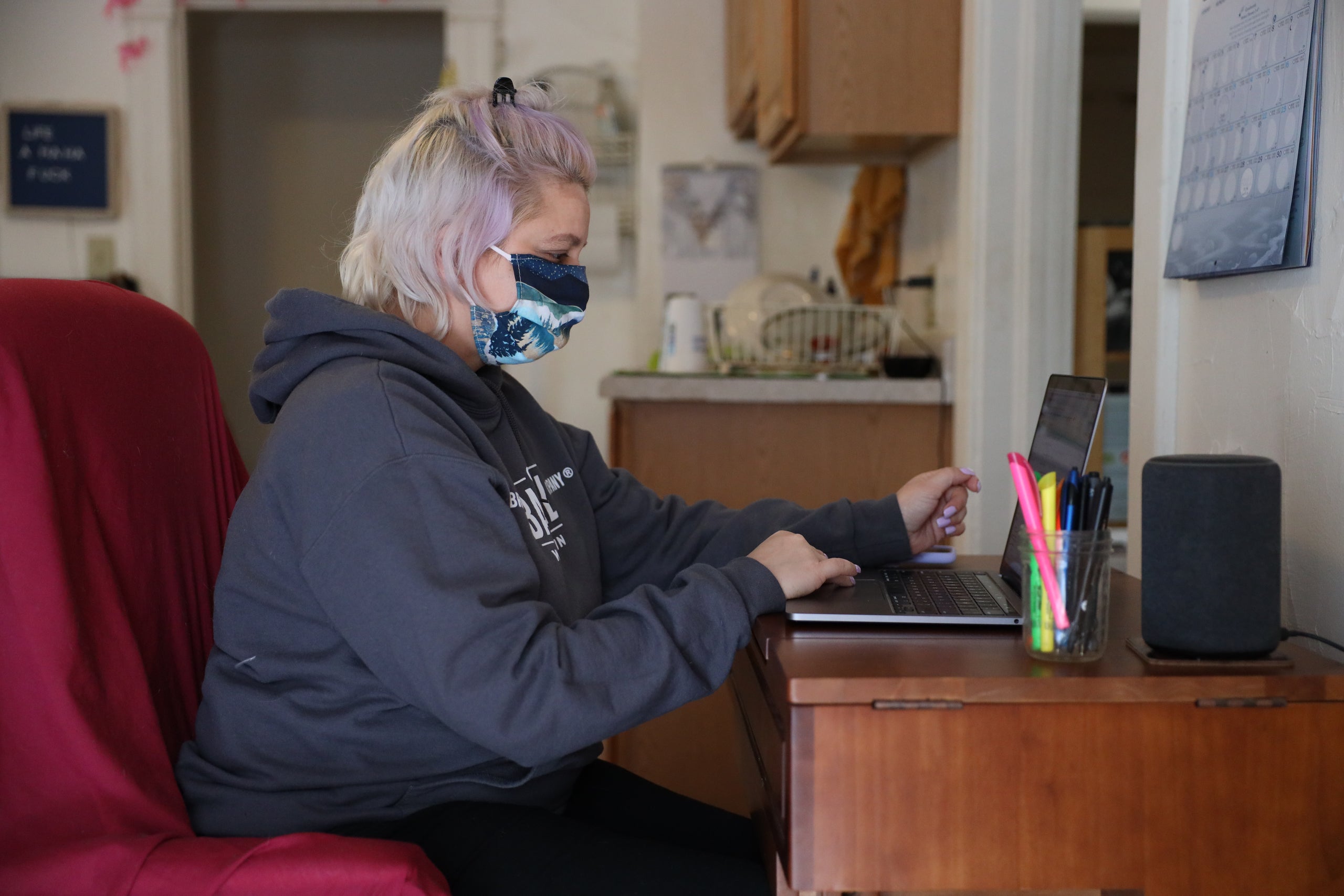 a woman uses a laptop computer