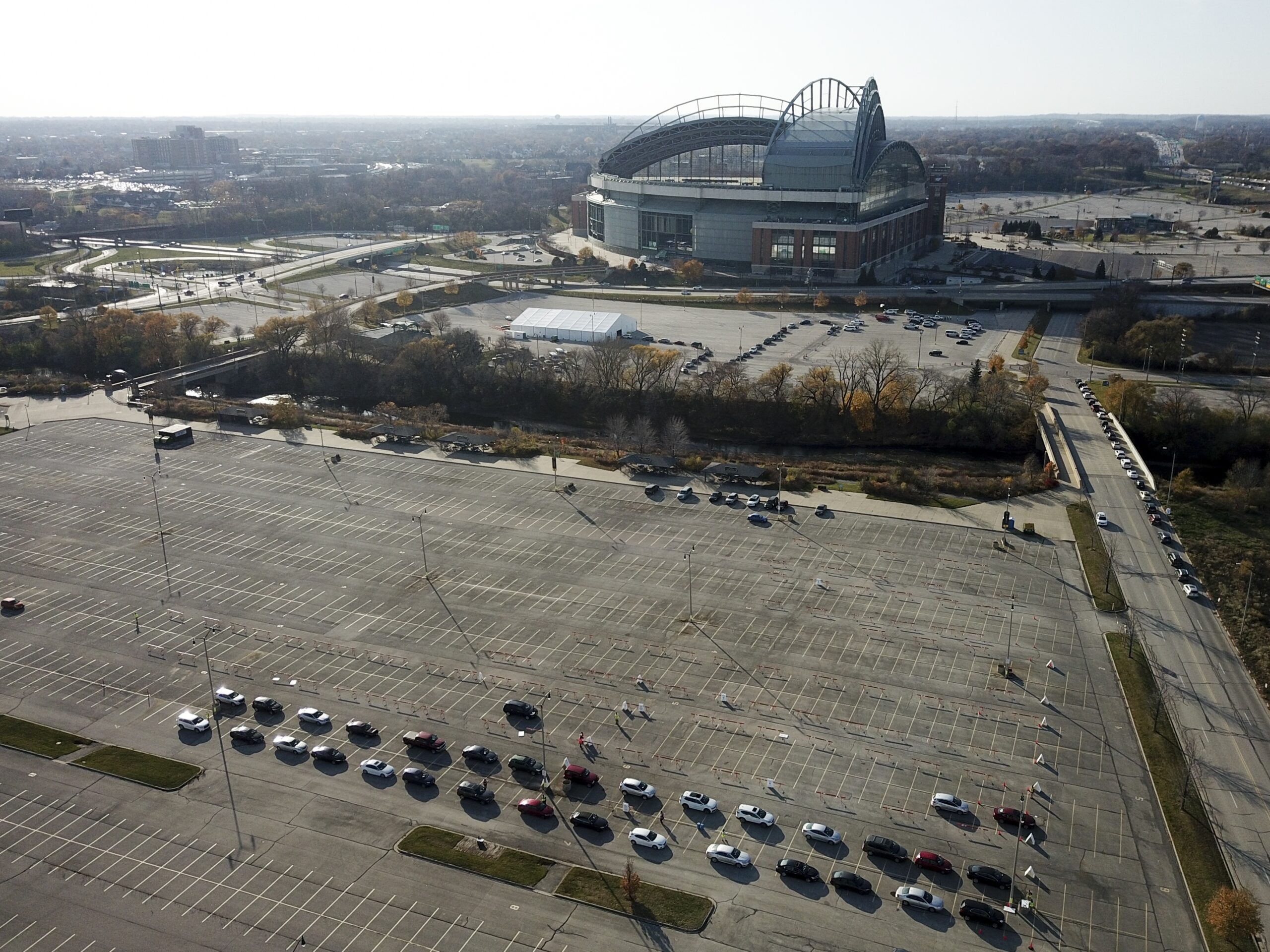 Cars line up at a COVID-19 testing site outside Miller Park in Milwaukee.