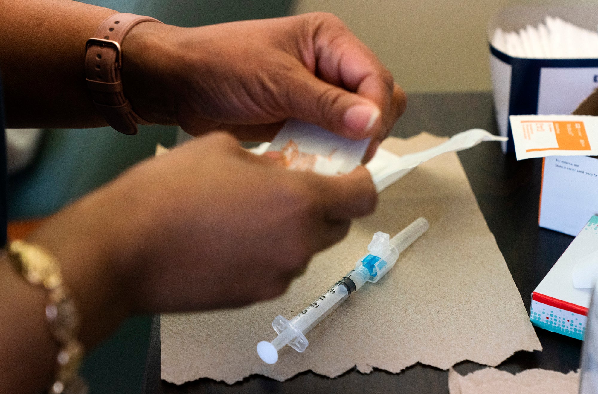 Nurse Michelle Martin prepares a COVID-19 vaccination.