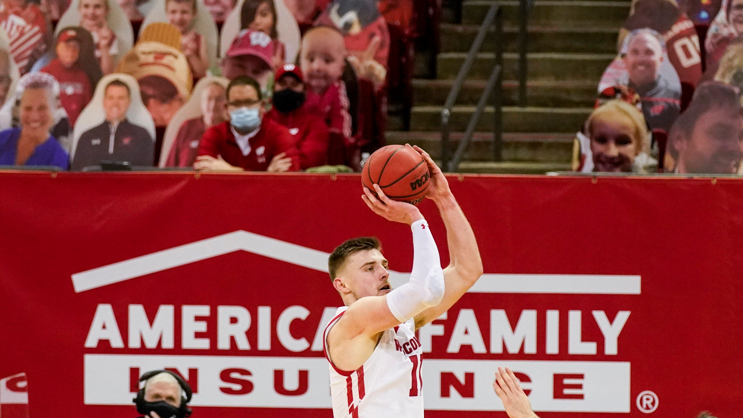 Senior forward Micah Potter takes a jump shot