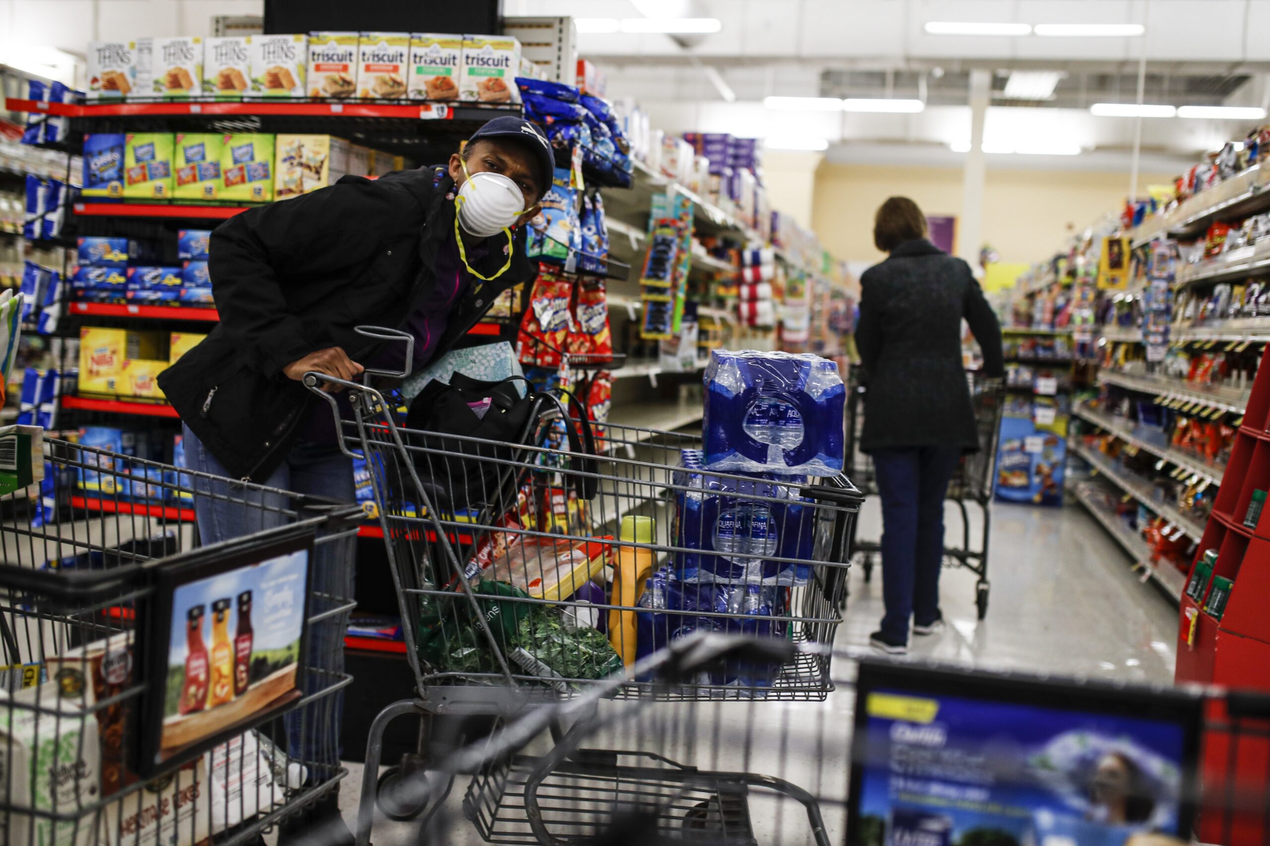 Customers shop at the grocery store during the coronavirus pandemic