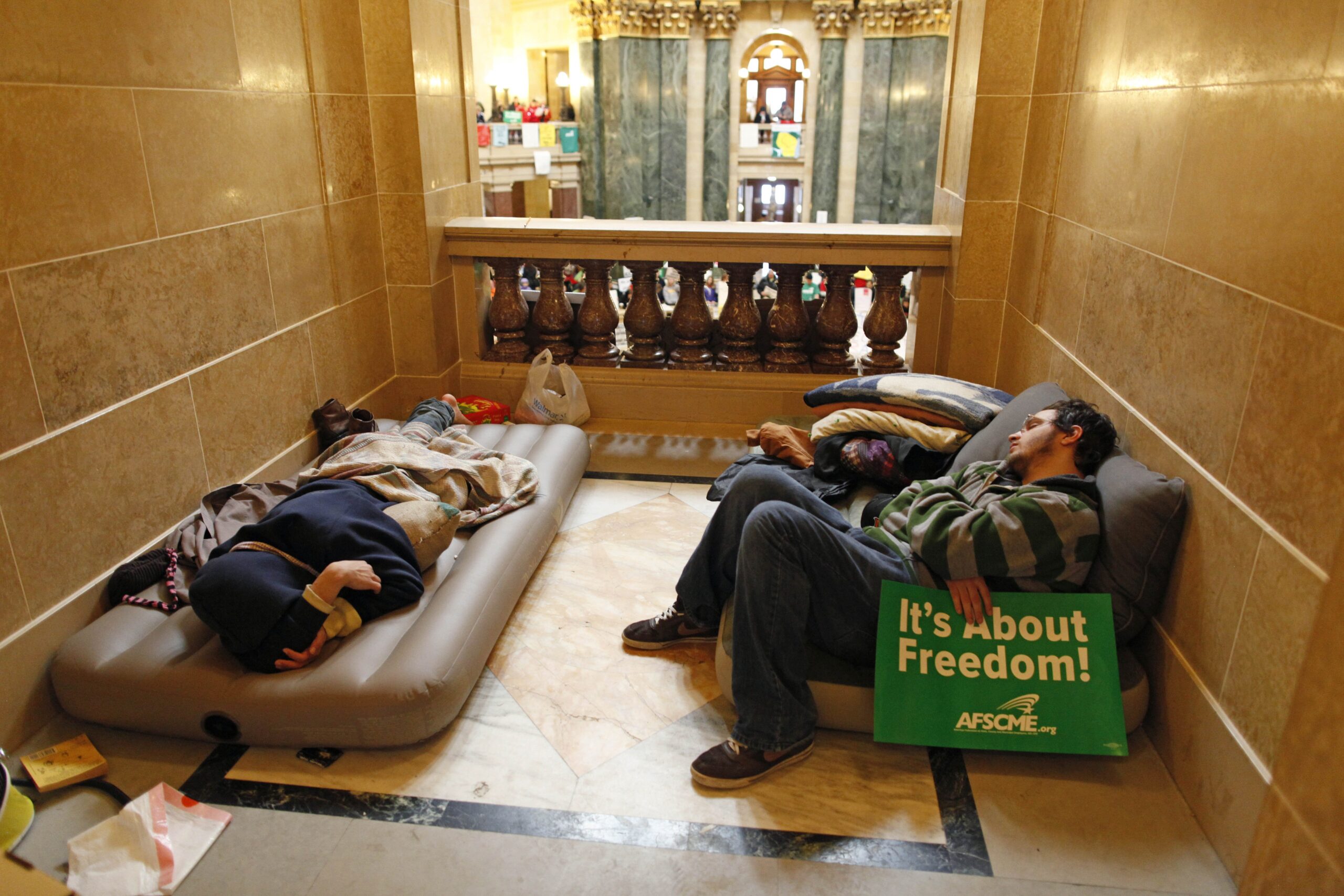 Protesters take a break inside the State Capitol
