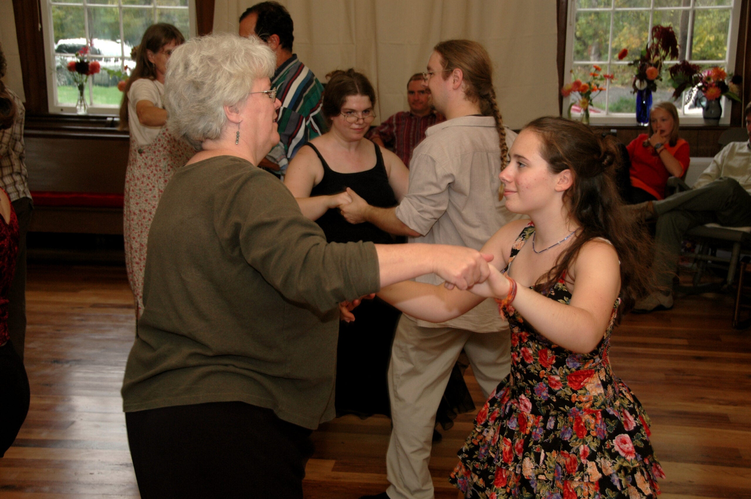 Two people contra dancing