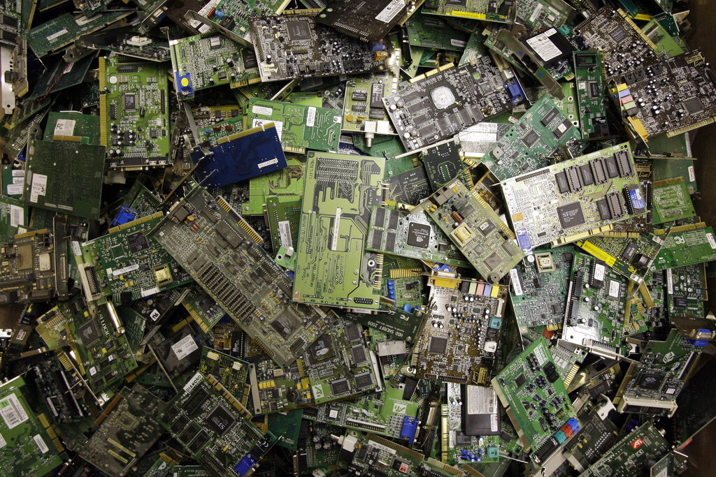 A close-up photo of a pile of circuit boards.