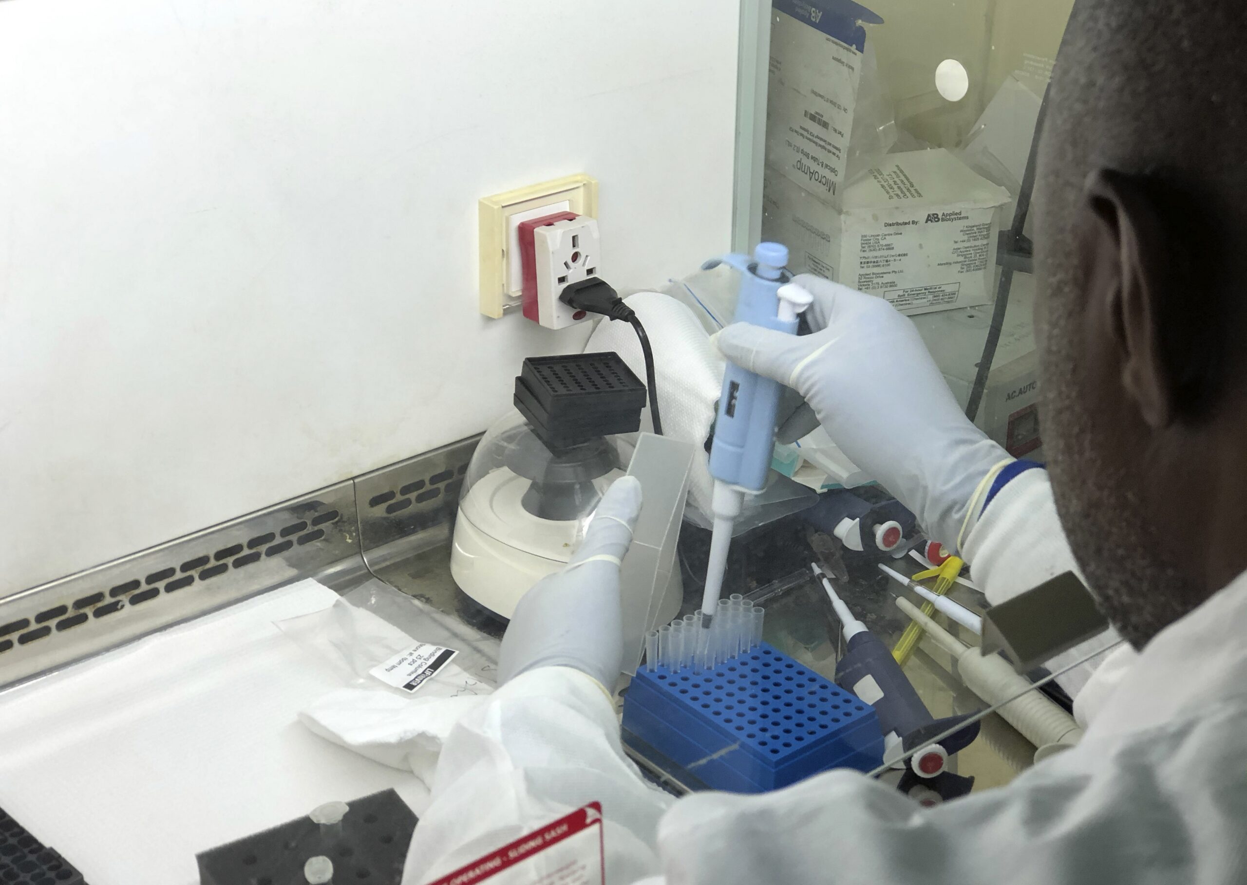 A scientist in Nigeria sequences a sample of COVID-19 in his lab